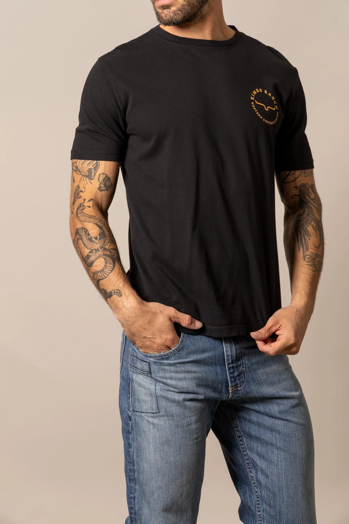 Kimes Ranch 1956 Black short sleeve shirt with a small gold logo on the chest