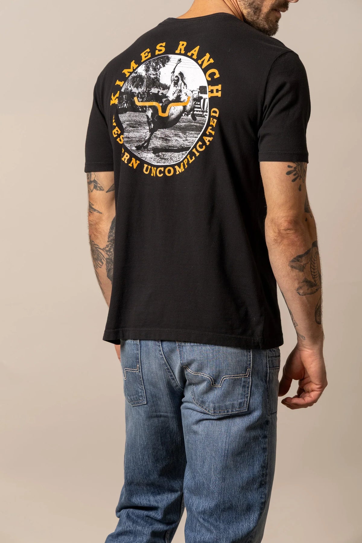 Kimes Ranch 1956, back view, Black shirt with a large back graphic of a cowboy on a bucking horse
