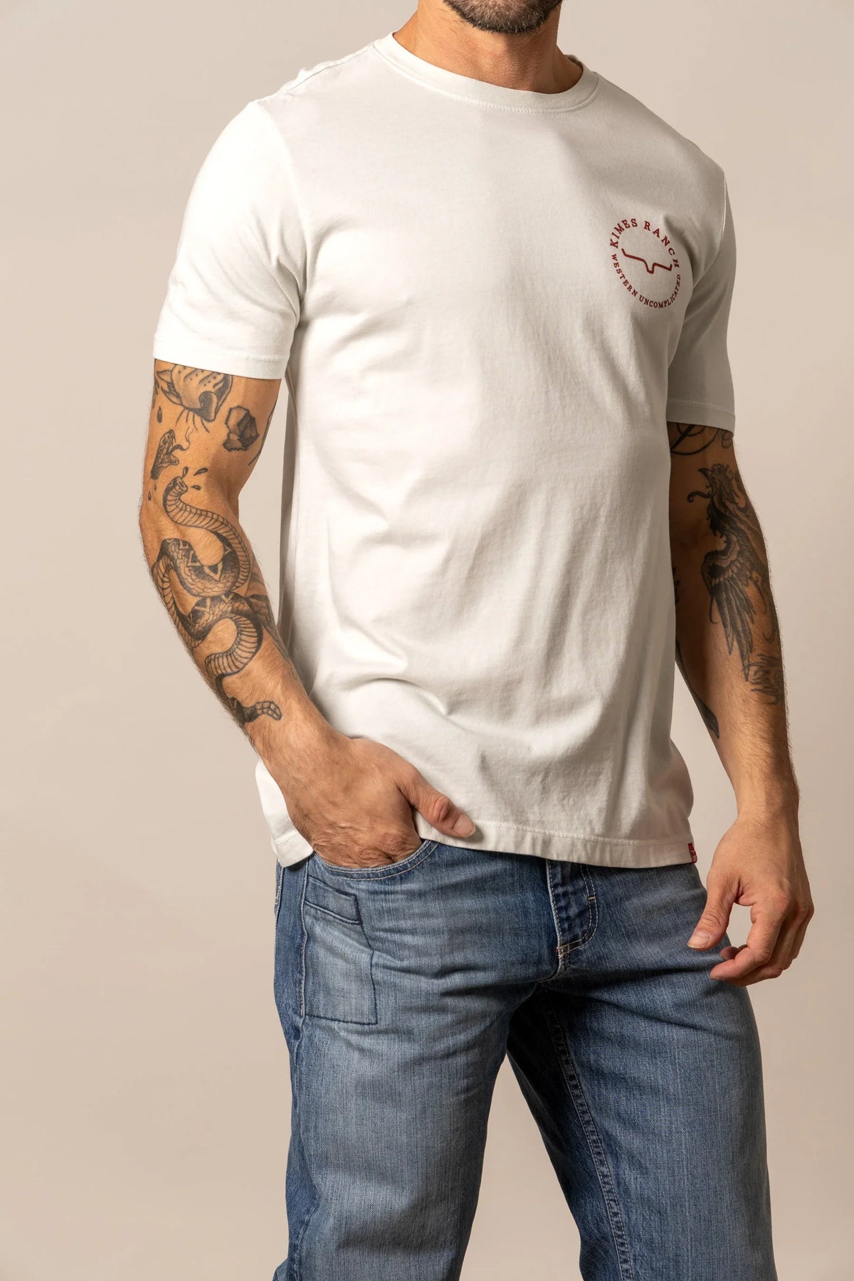 Kimes Ranch 1956 Natural short sleeve shirt with a Kimes Ranch logo on the chest
