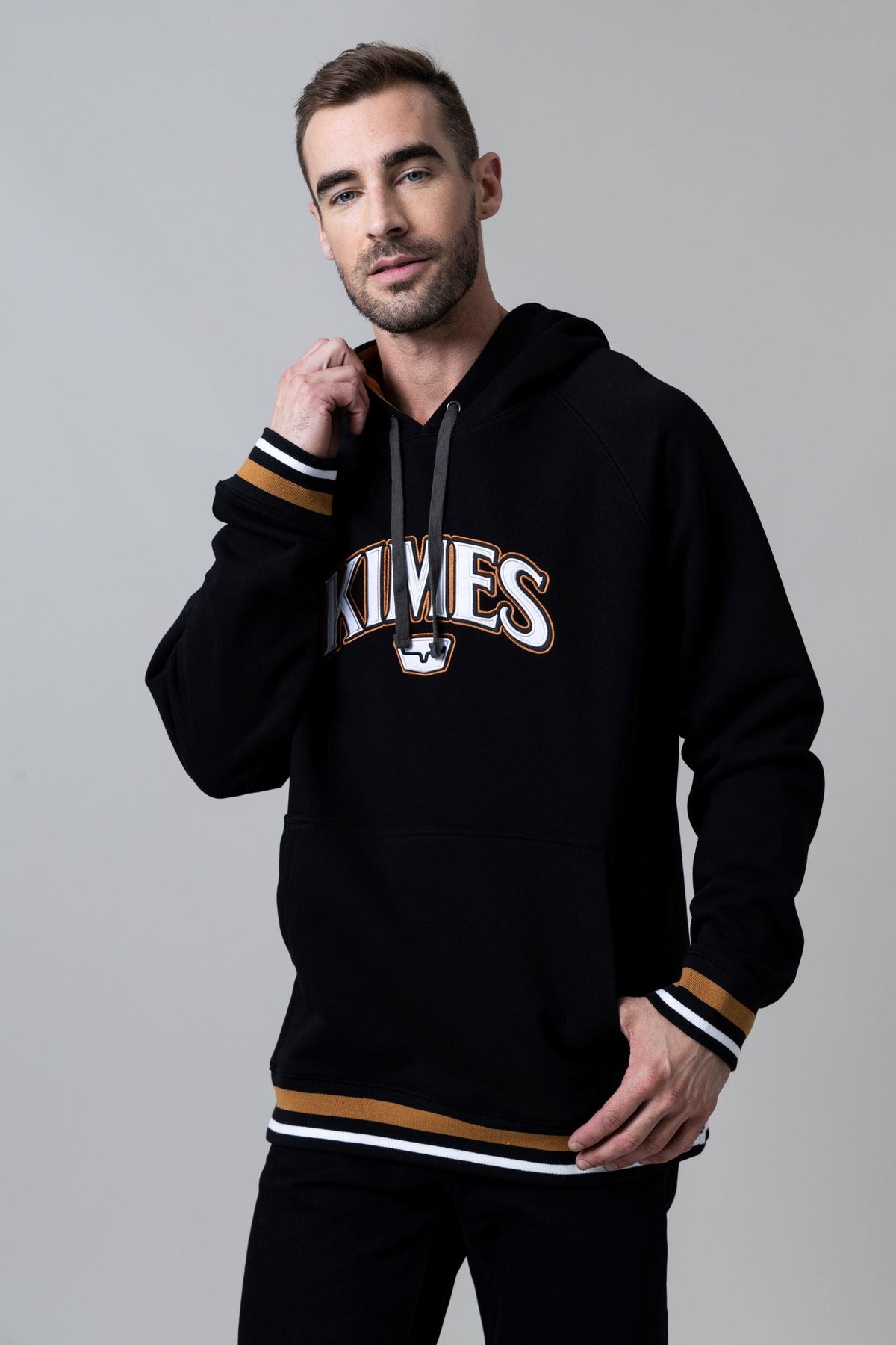 Kimes Ranch Kubo Hoodie in Black with Kimes Ranch logo and striped cuffs