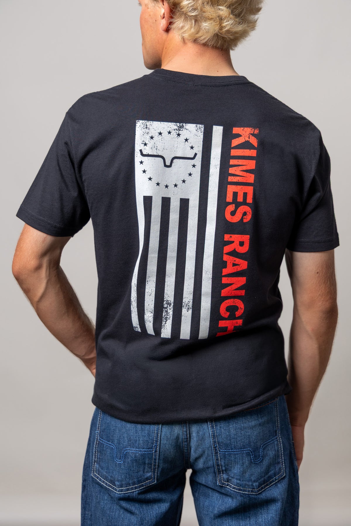 Kimes Ranch 76, back view, shirt back with distressed flag graphic and Kimes Ranch logo in red