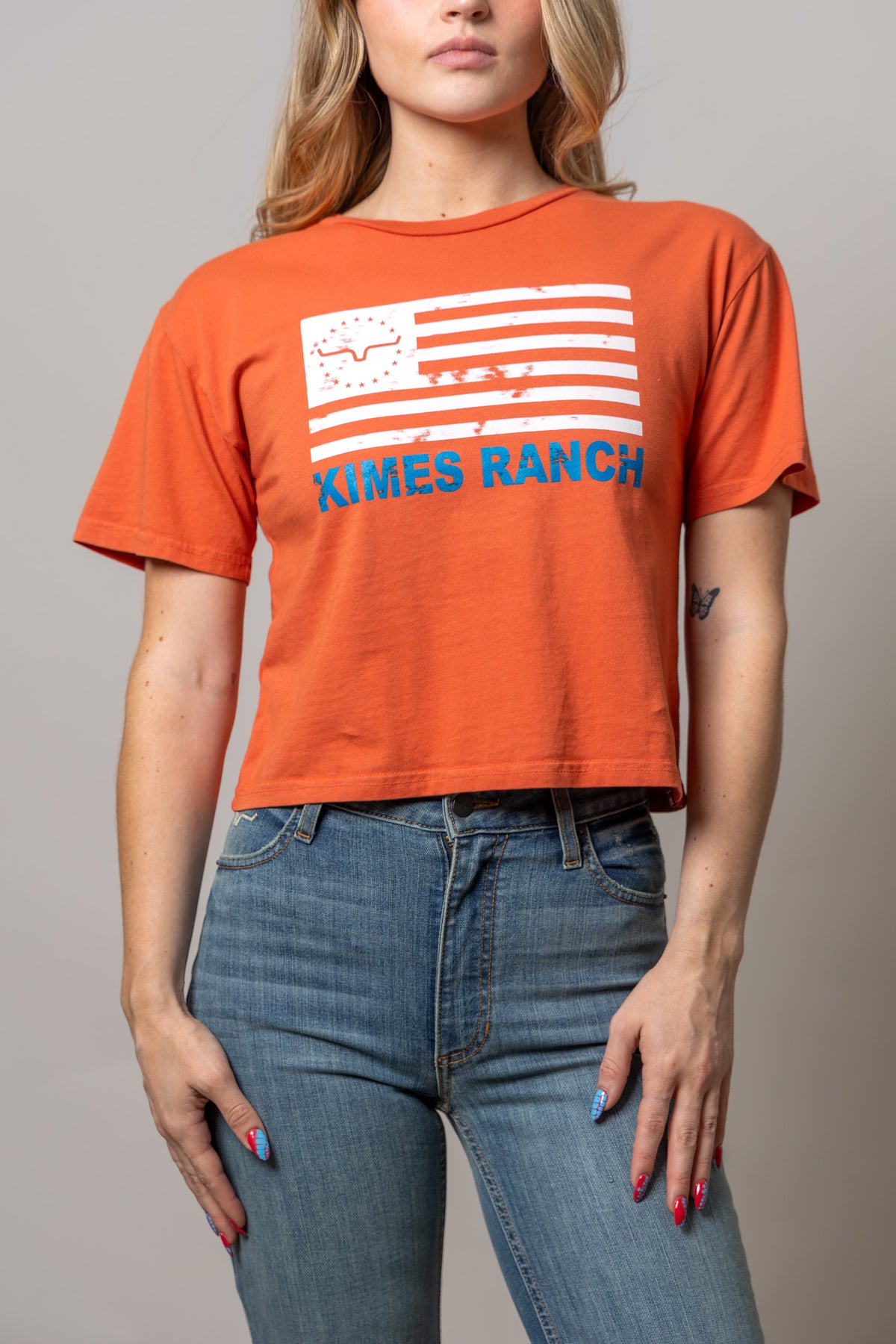 Kimes Ranch Spice Red 76 shirt with a distressed flag graphic and blue Kimes Ranch text