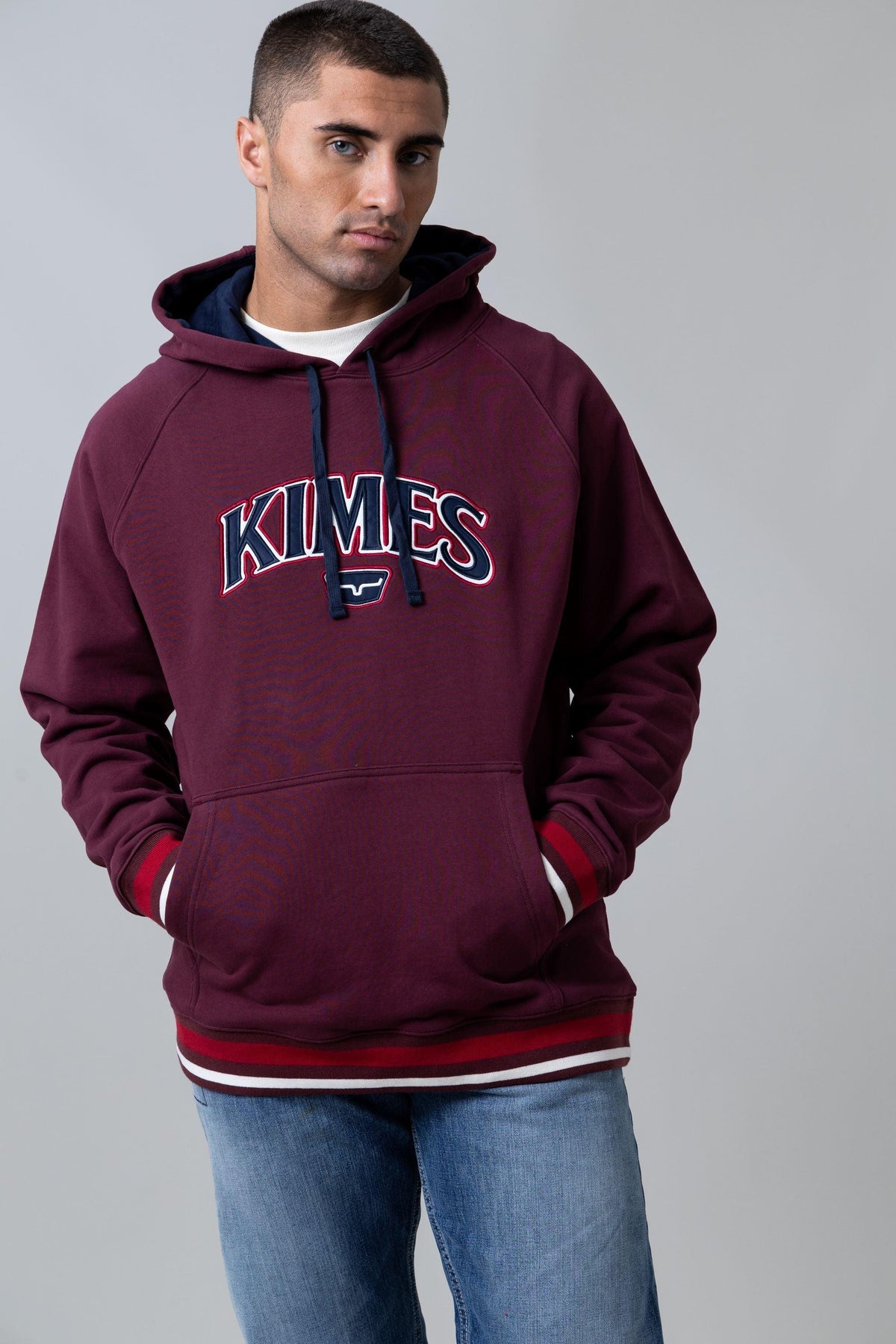 Kimes Ranch Kubo Hoodie in Burgundy with a front KIMES graphic and striped cuffs
