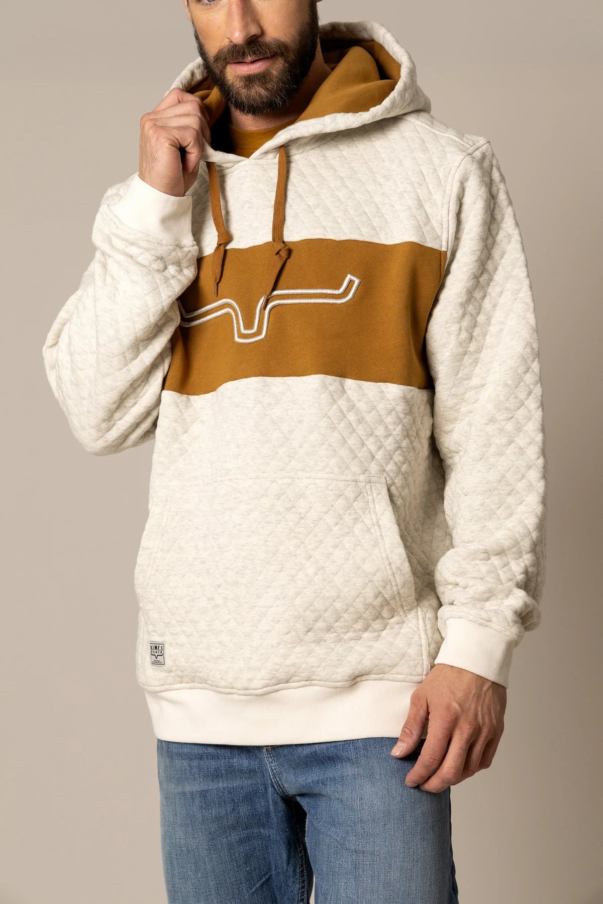 Kimes Ranch AF Ripon Hoodie in Natural with a quilted texture and a mustard stripe featuring the Kimes Ranch logo