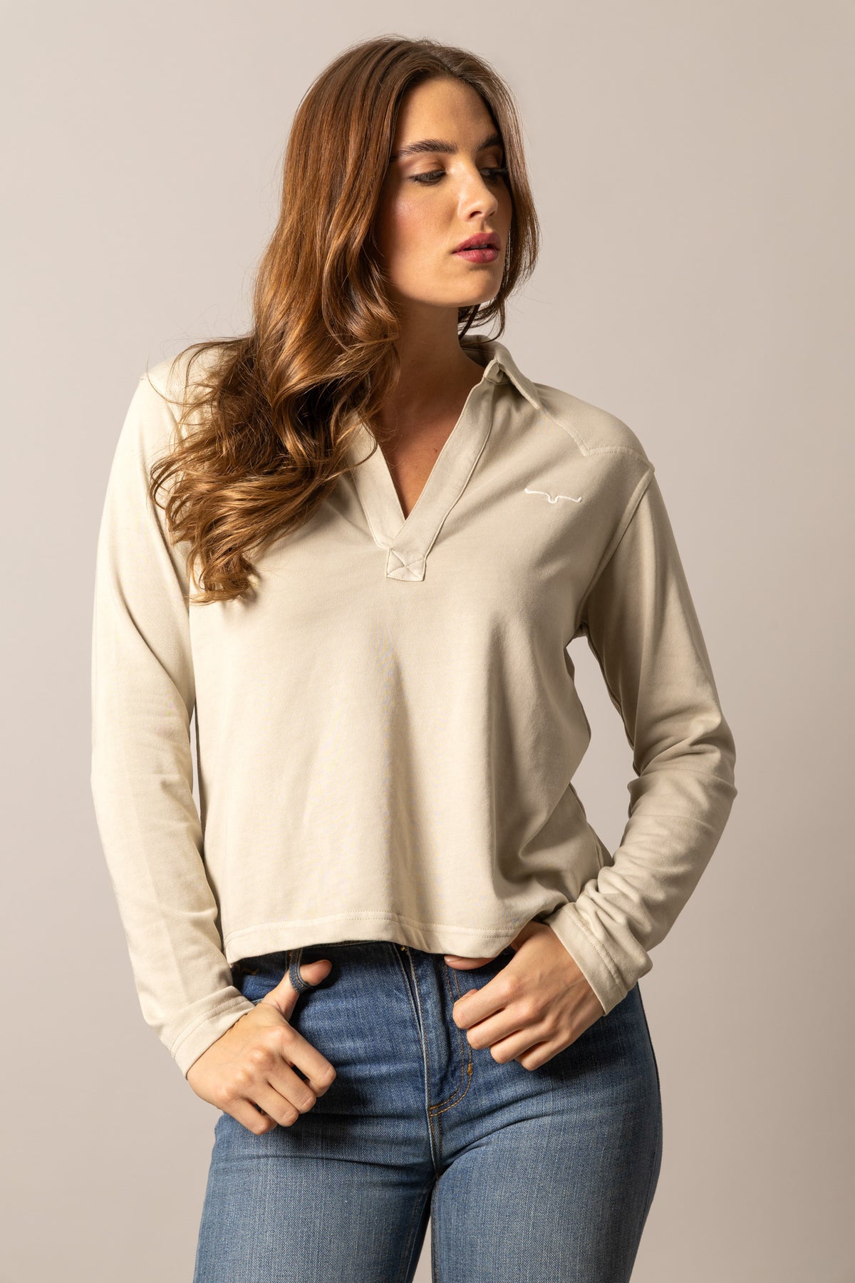 Kimes Ranch Abby top in Bone with a long sleeve polo collar and embroidered logo