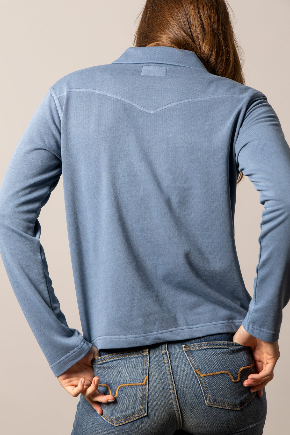 Kimes Ranch Abby top in Mid Blue, back view, with long sleeves and a back yoke
