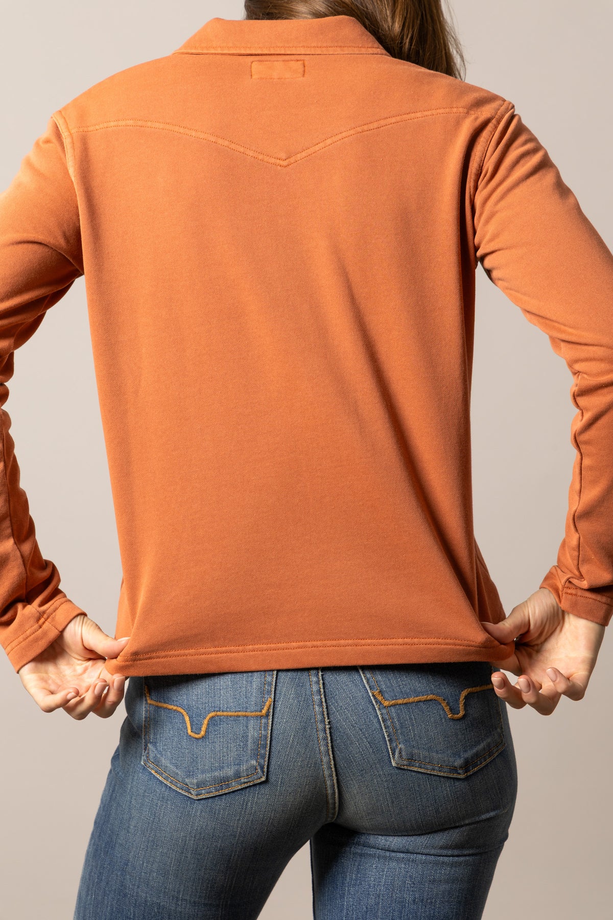 Kimes Ranch Abby top in Spice Red, back view, with a back yoke and long sleeves
