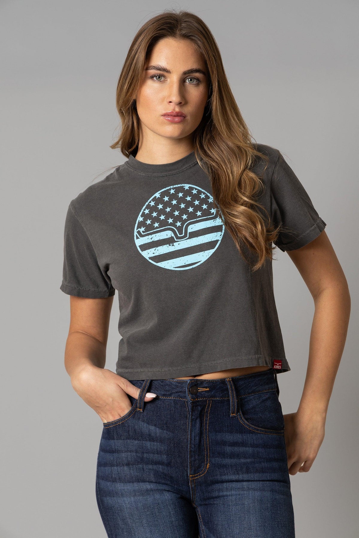 Kimes Ranch Ladies American Bullseye Crop shirt in Pepper with a distressed light blue circular graphic featuring stars