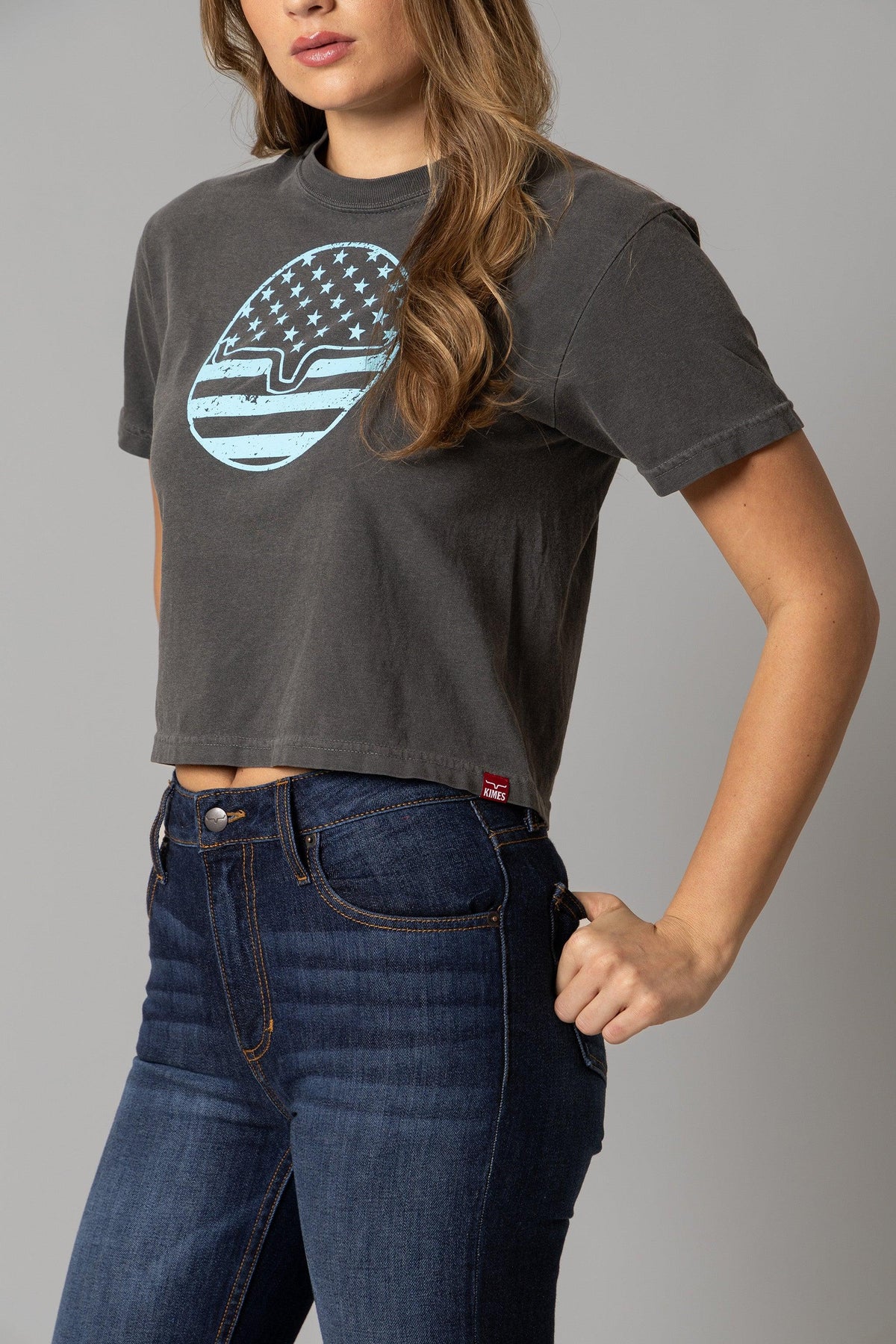 Kimes Ranch Ladies American Bullseye Crop shirt in Pepper with a distressed American flag graphic on the front