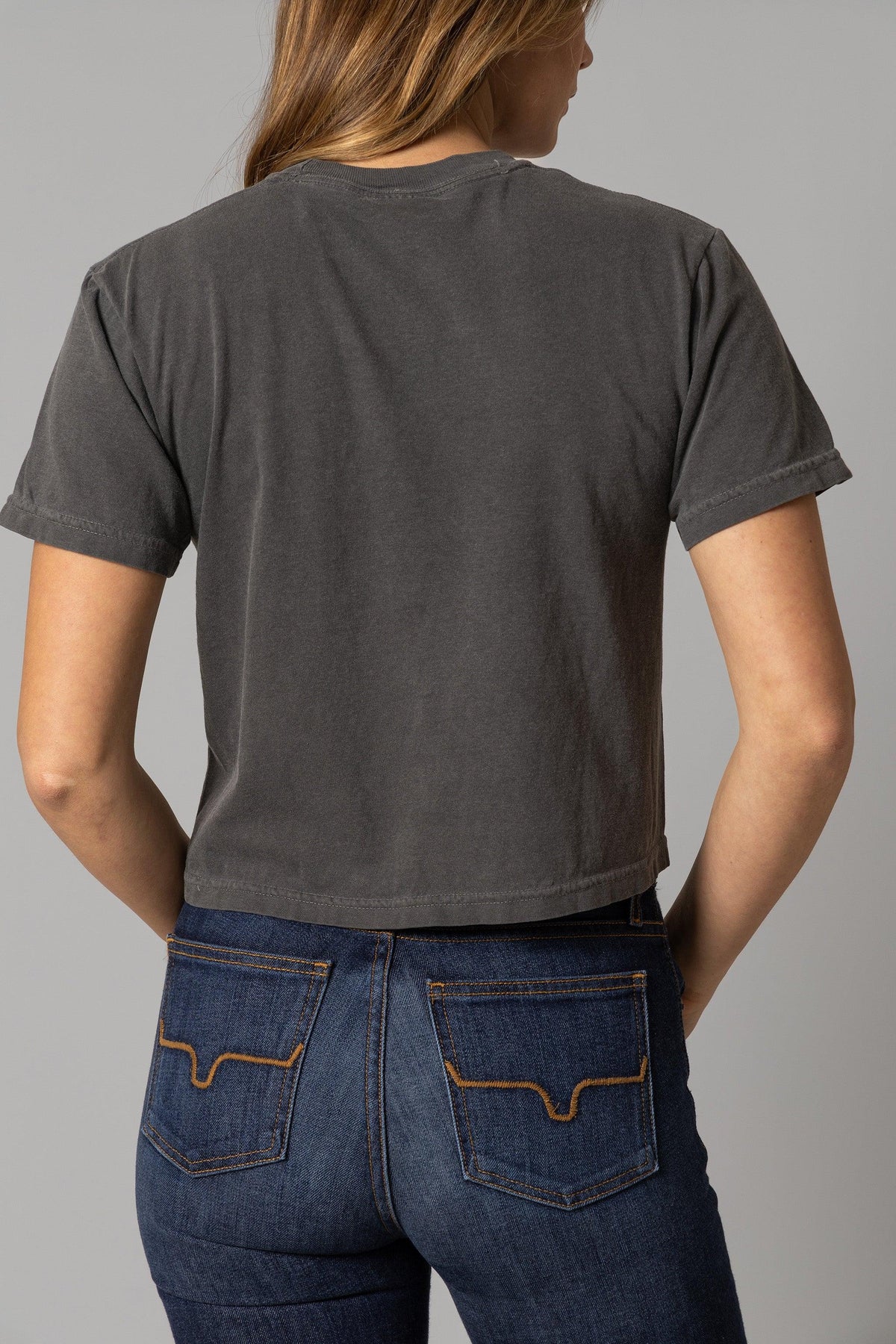 Kimes Ranch Ladies American Bullseye Crop shirt in Pepper, back view, with short sleeves and a crew neck