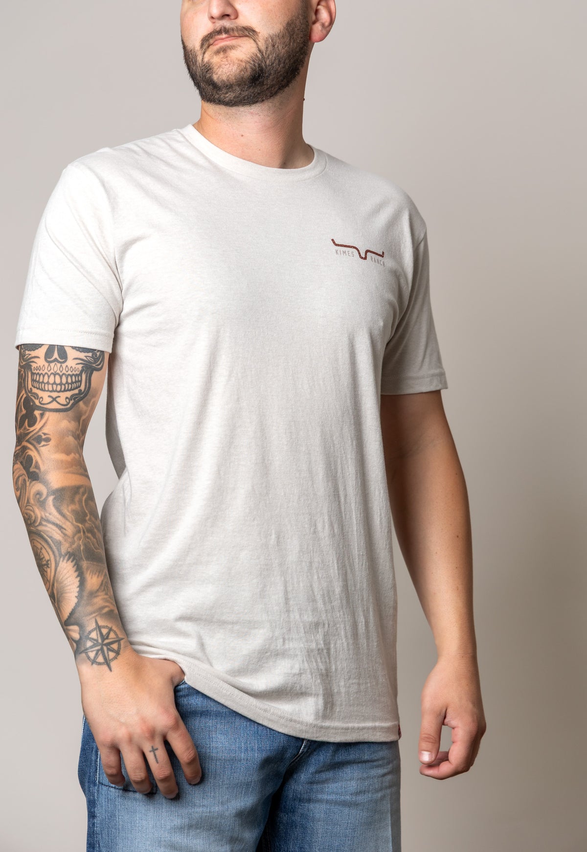 Kimes Ranch American Cowboy shirt in Sand with short sleeves and the Kimes Ranch logo on the chest