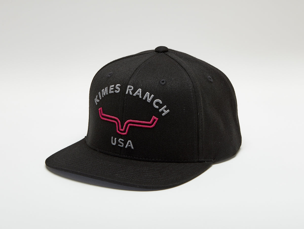 Kimes Ranch Arched Trucker Hat in Black with the Kimes Ranch logo and USA text embroidered on the front