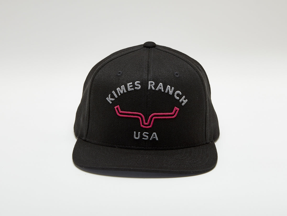 Kimes Ranch Arched Trucker Hat in Black with the Kimes Ranch logo embroidered on the front