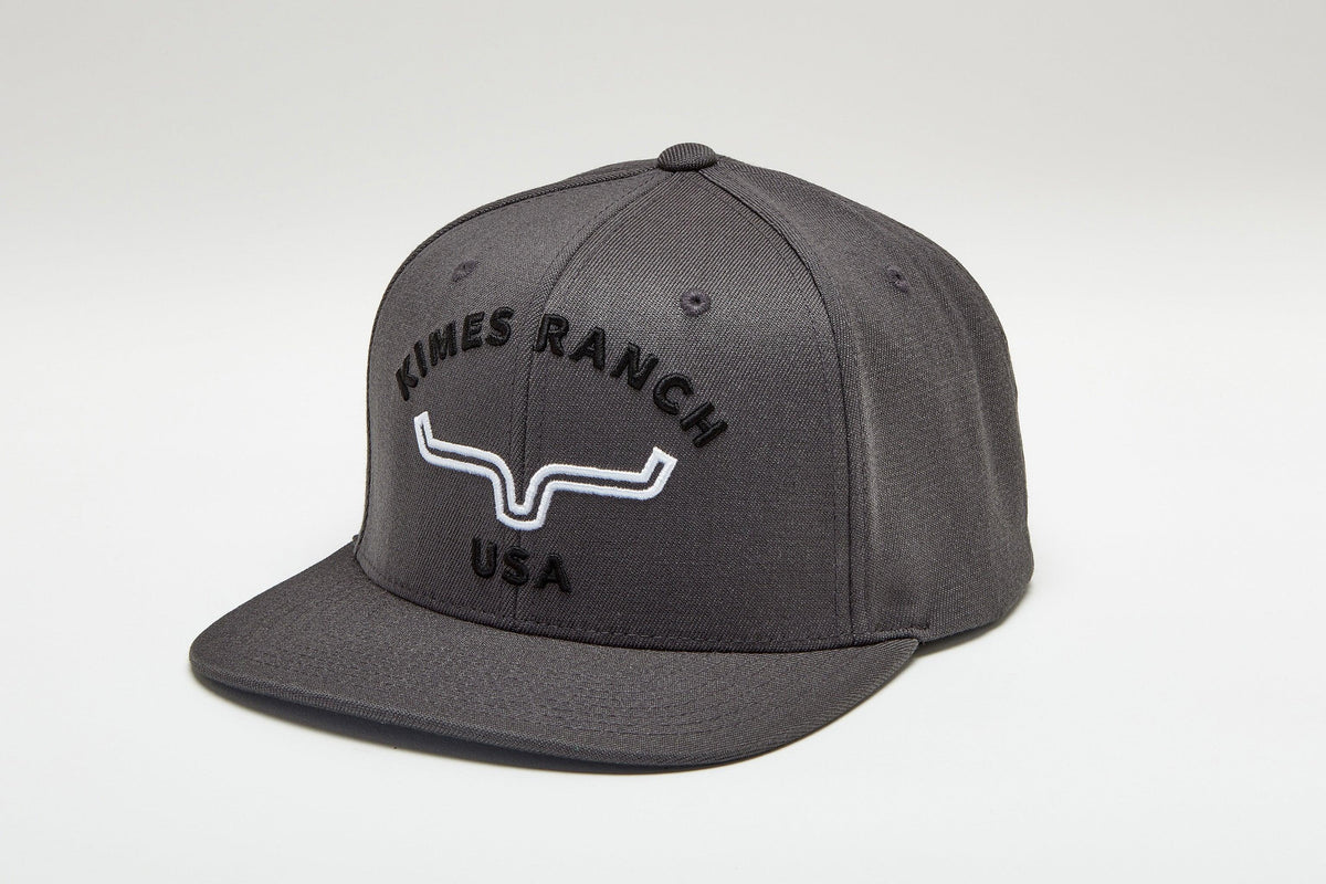 Kimes Ranch Arched Trucker Hat in Charcoal with the Kimes Ranch logo embroidered on the front