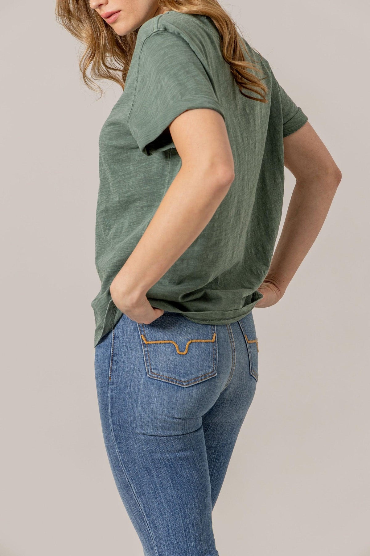Kimes Ranch Ashley Tee in Pine, side view, with short sleeves and a relaxed fit