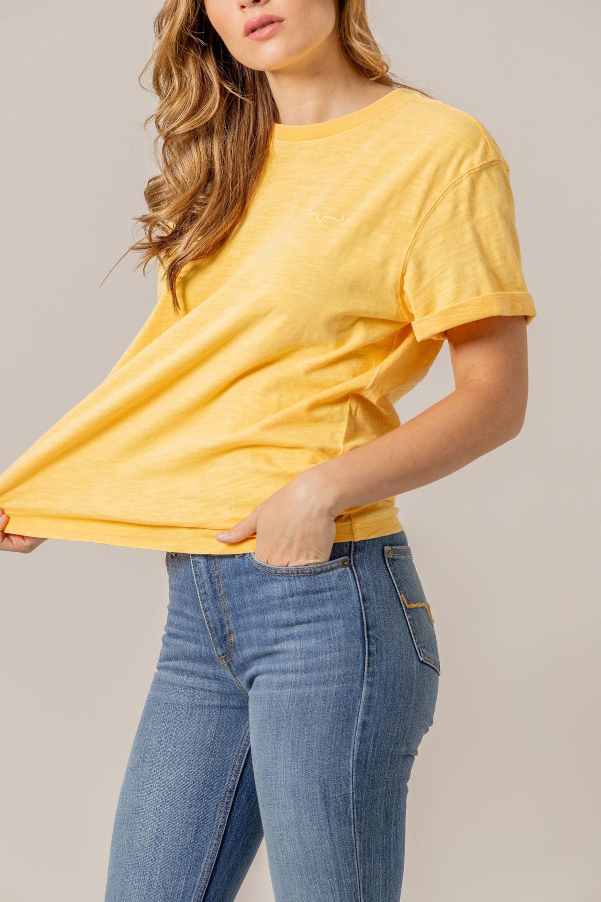 Kimes Ranch Ashley Tee in Yellow with short sleeves and a small embroidered logo on the chest