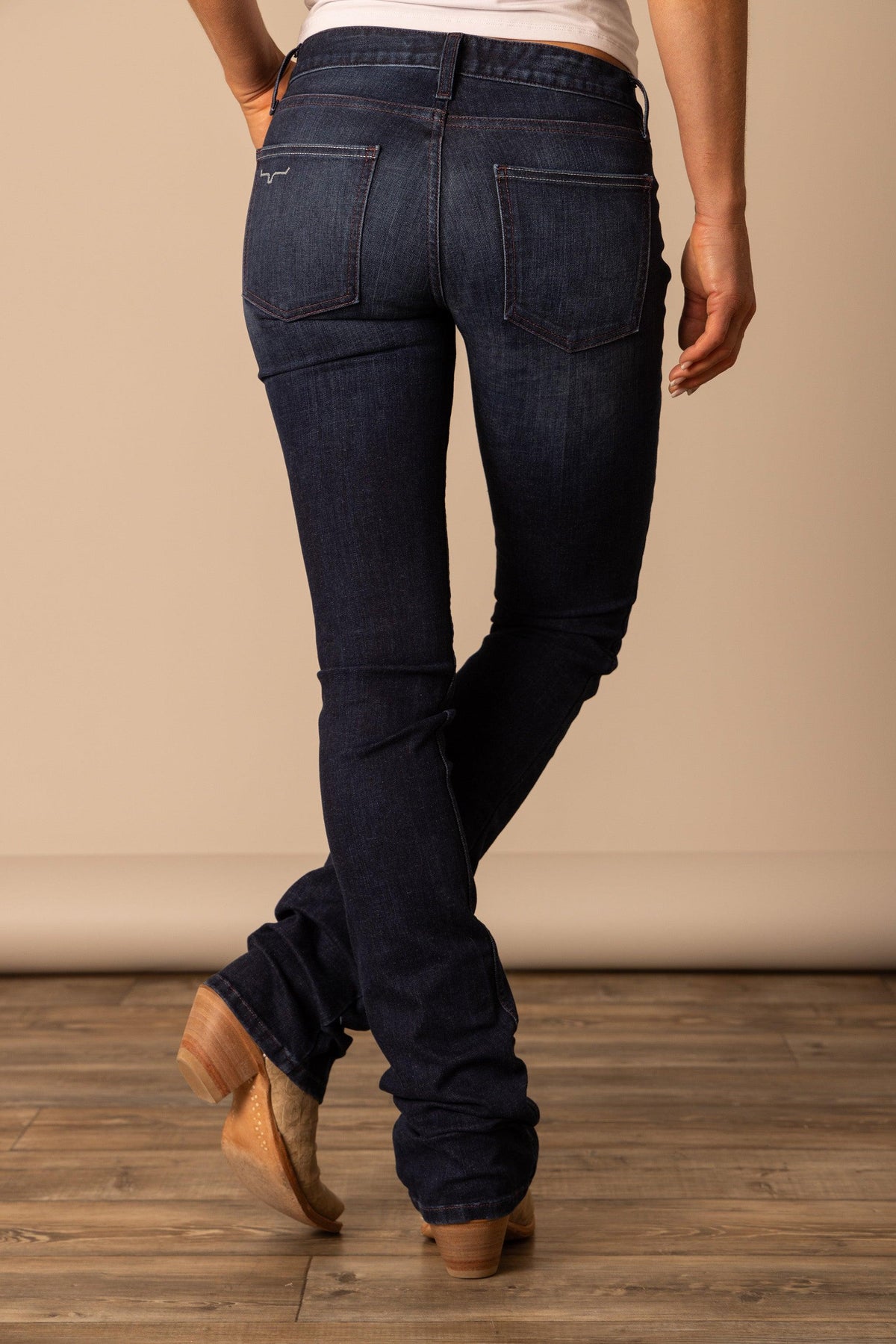 Kimes Ranch Audrey jeans in Dark Wash, back view, with back pockets and a Kimes Ranch logo