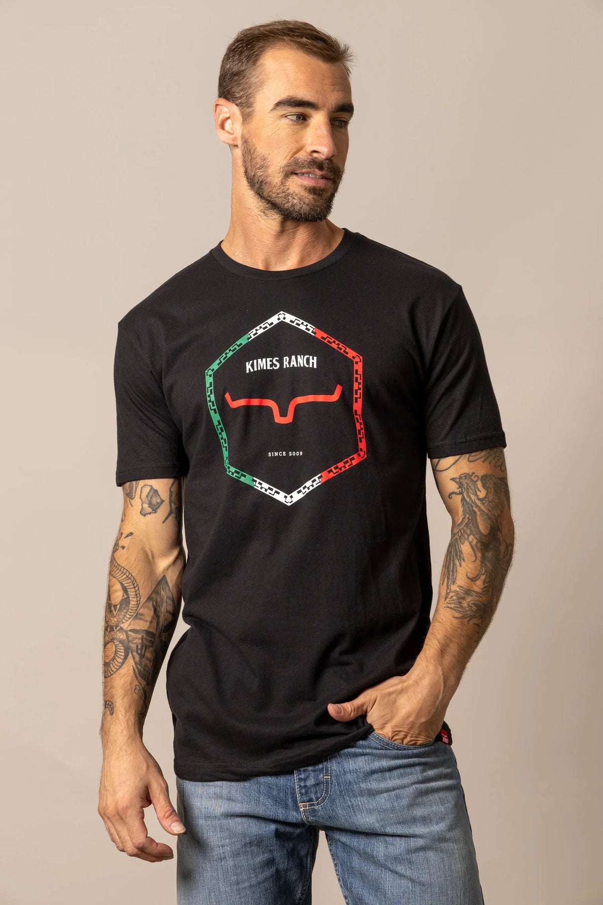 Kimes Ranch Baja Diamond black short sleeve shirt with a hexagonal logo featuring the Kimes Ranch logo and text