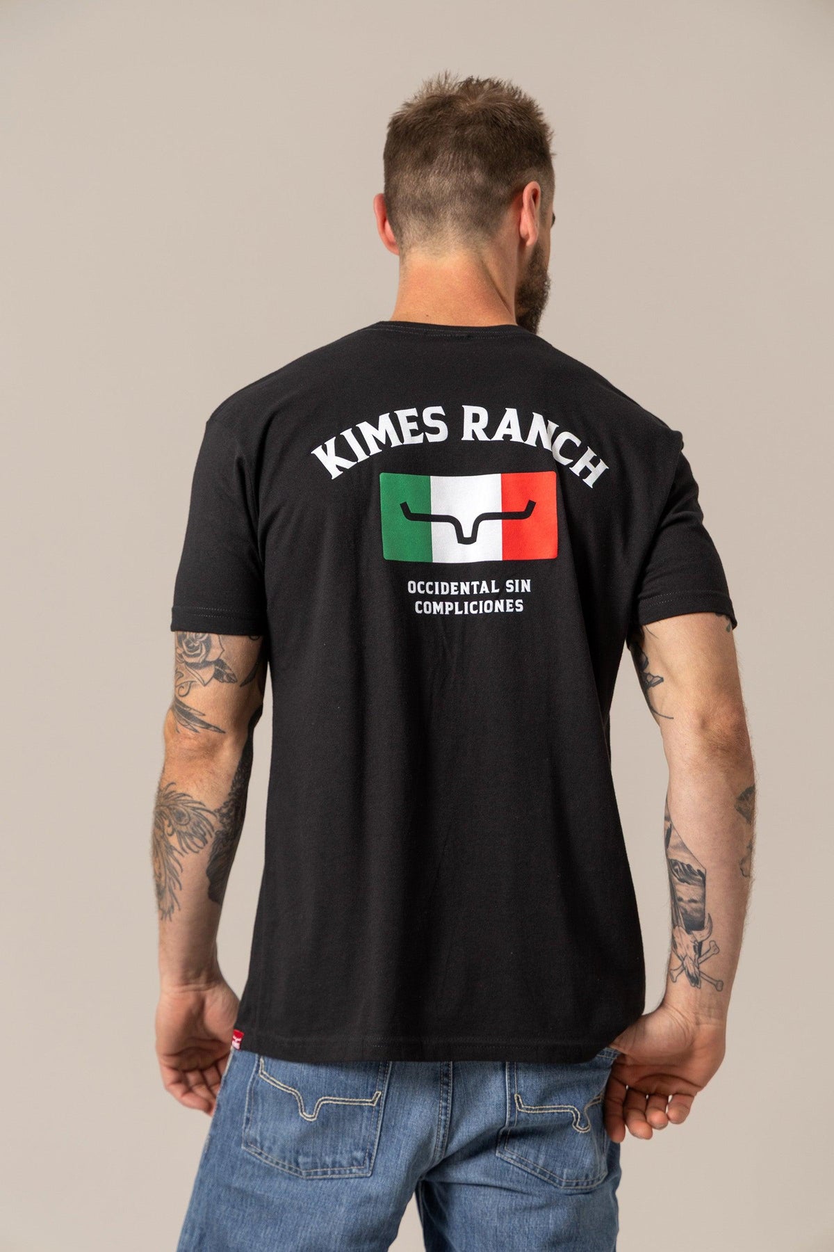 Kimes Ranch Bandera Tee in Black, back view, with back graphic featuring Kimes Ranch logo over Italian flag