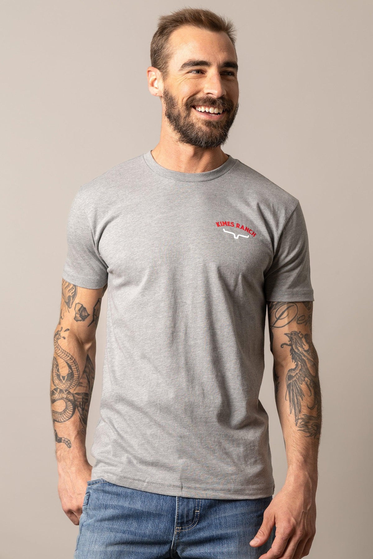 Kimes Ranch Bandera Tee in Dark Grey Heather with a red and white Kimes Ranch logo on the chest