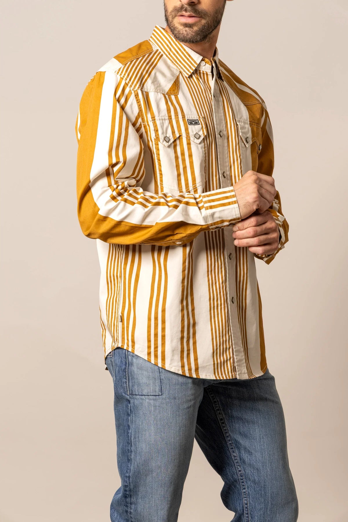 Kimes Ranch Bandit dress shirt in Work Wear Brown, side view, with white vertical stripes and solid yoke