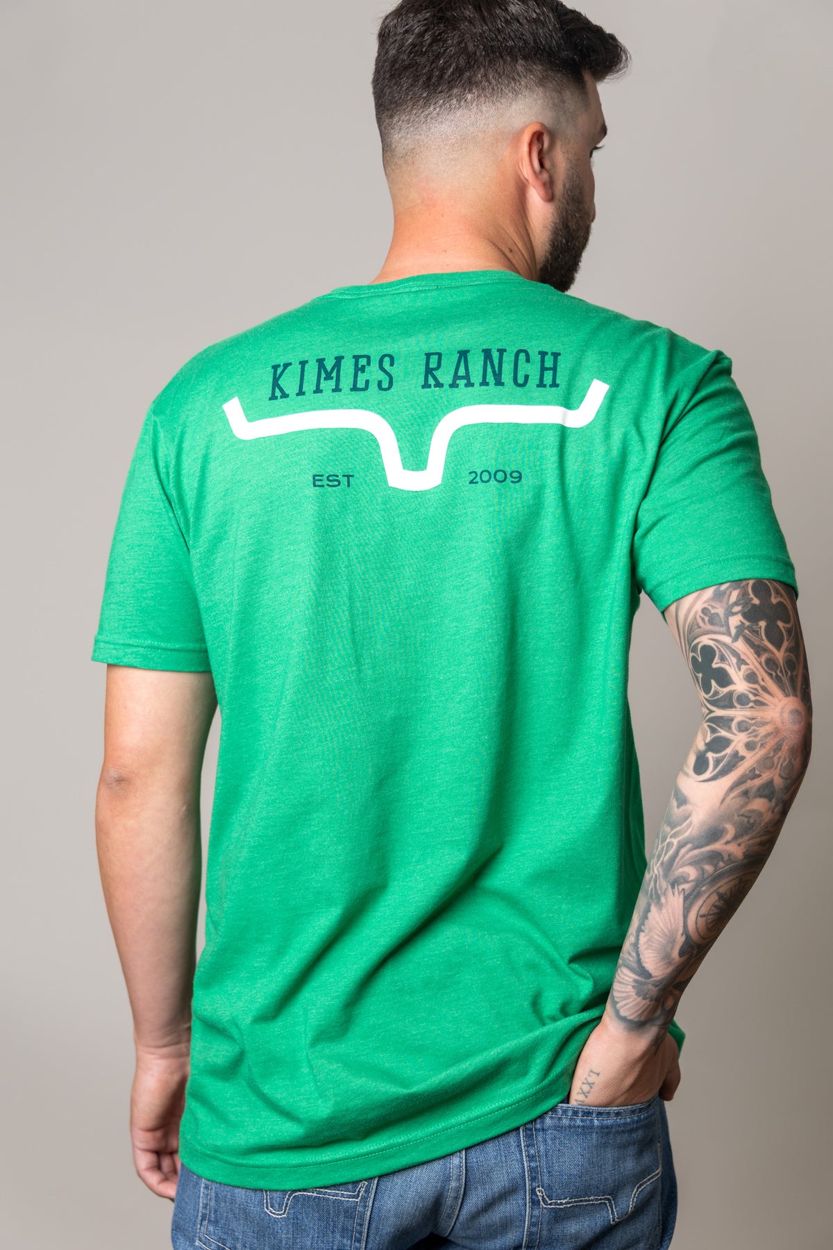 Kimes Ranch Bar Doors shirt in Kelly Green, back view, with the Kimes Ranch logo and EST 2009 text on the back
