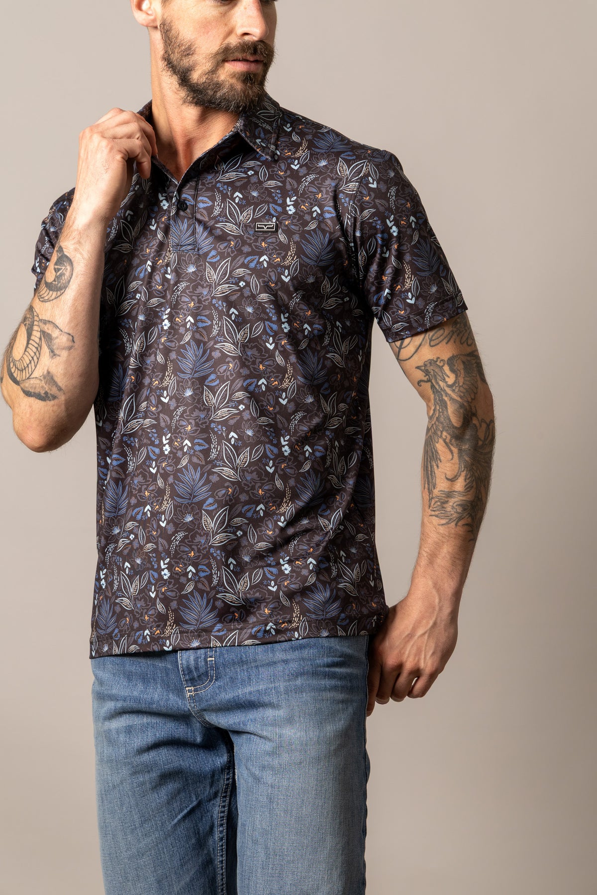 Kimes Ranch Bartram polo in Black with a blue and white leaf pattern and a logo on the chest