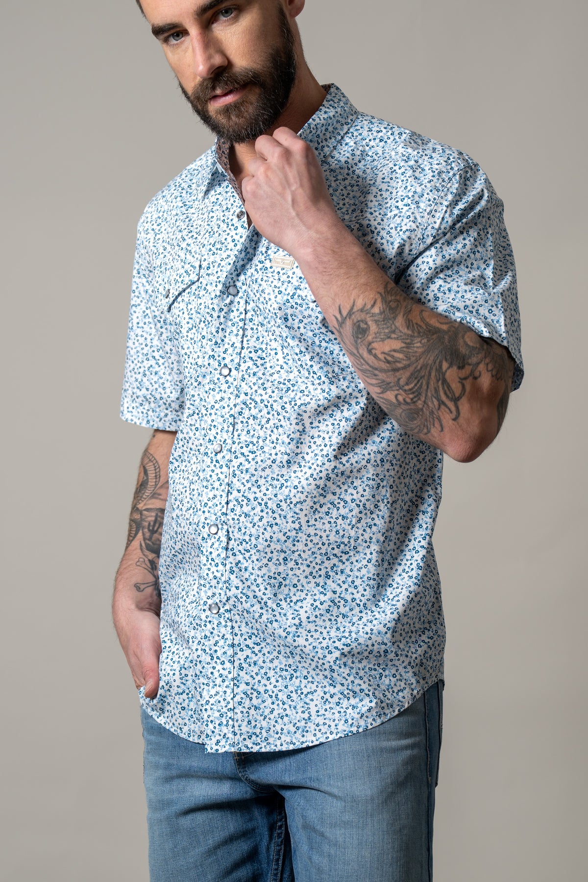 Kimes Ranch Bascom short sleeve dress shirt in Blue with a small floral print and two chest pockets