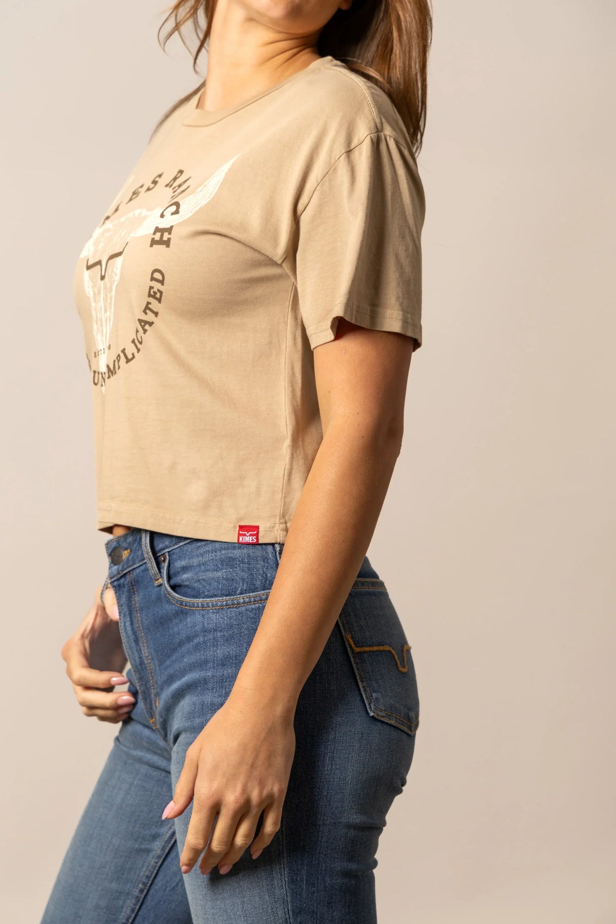 Kimes Ranch Bison Skull shirt in Tan, side view, with a graphic print and short sleeves
