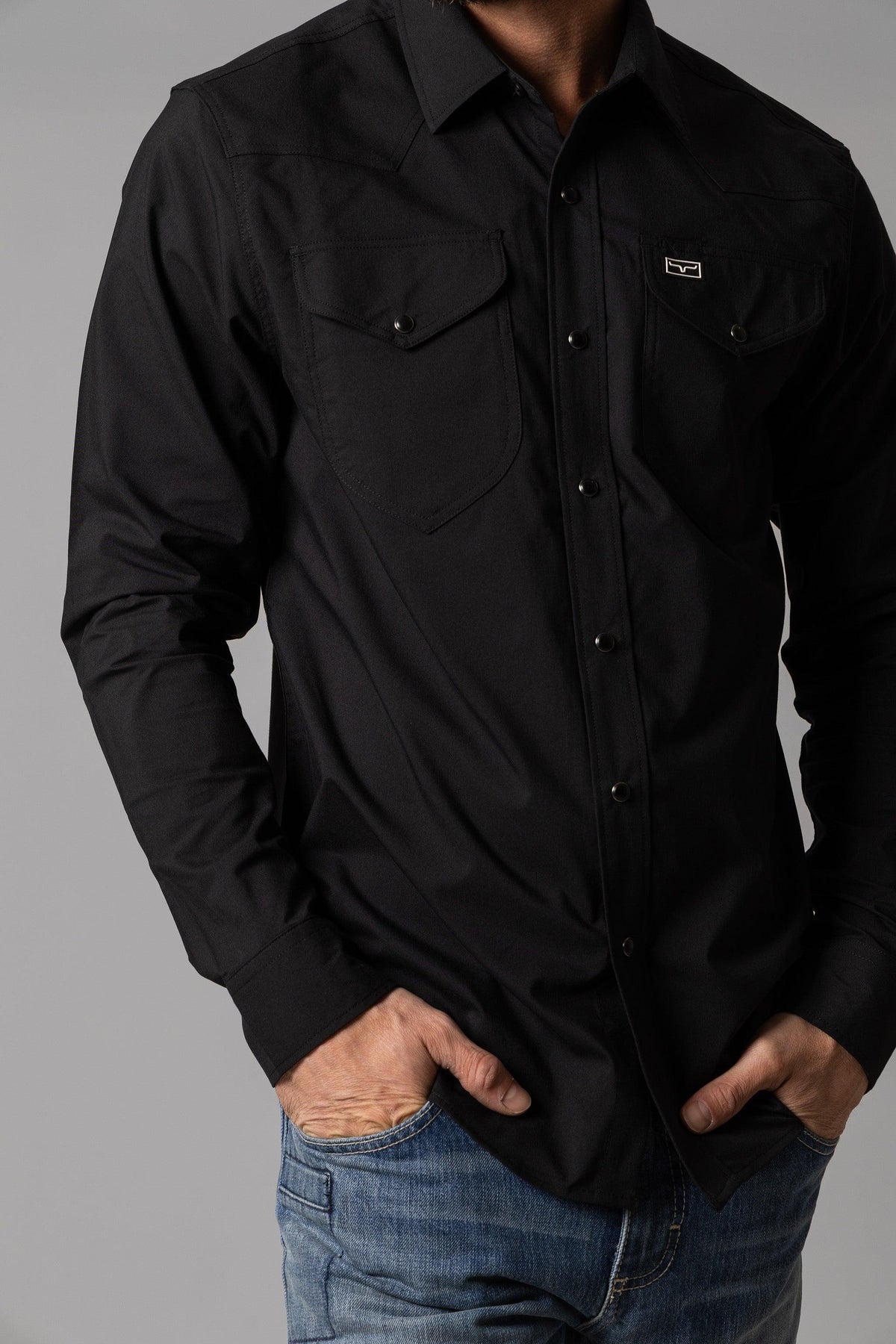 Kimes Ranch Blackout Dress Shirt in Black with long sleeves and two chest pockets with button flaps