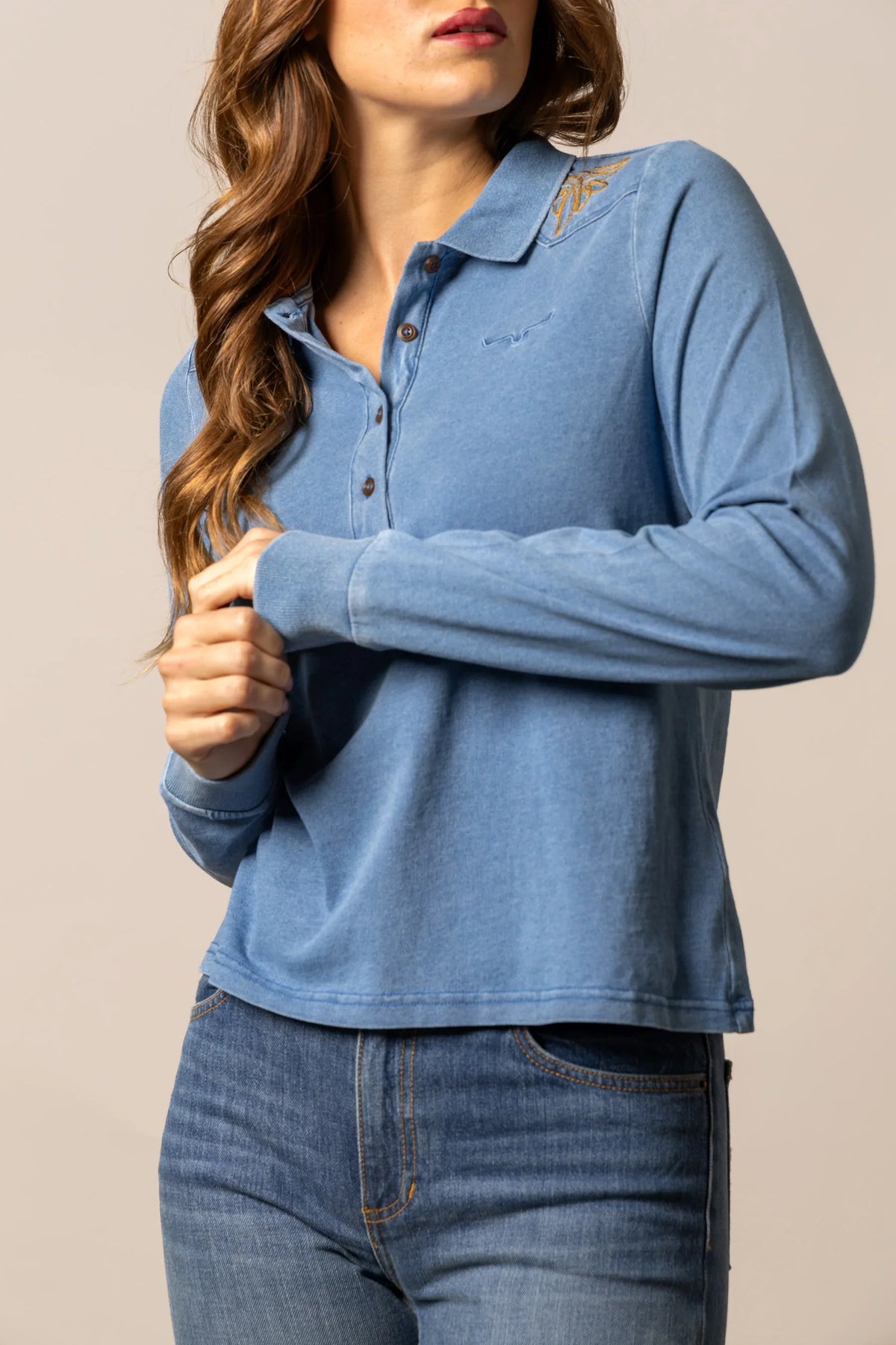 Kimes Ranch Bluebell long sleeve polo top in Indigo, side view, with embroidered logo on the collar and chest