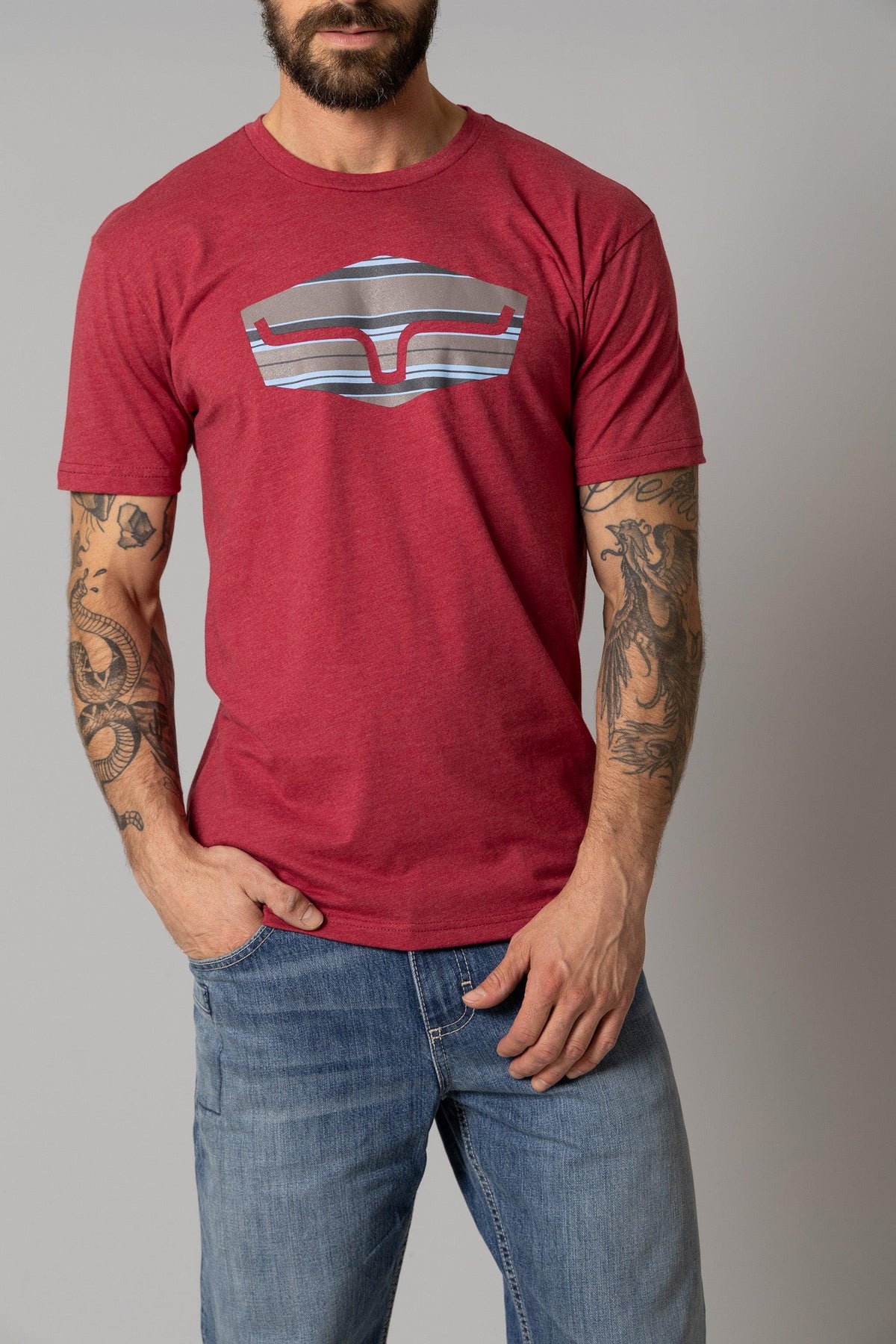 Kimes Ranch Box Seats Striped shirt in Cardinal with a stylized steer logo graphic on the chest