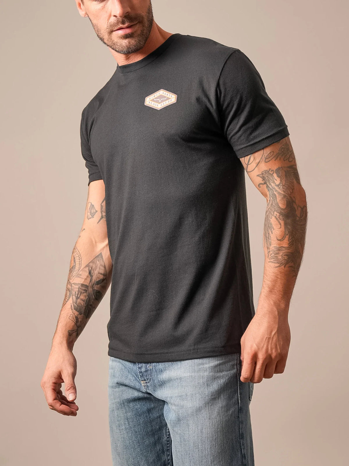 Kimes Ranch Boxer shirt in Black, side view, with a chest logo