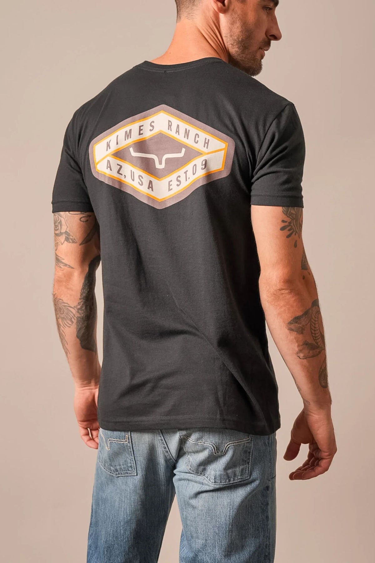 Kimes Ranch Boxer shirt in Black, back view, with a large Kimes Ranch logo graphic on the back