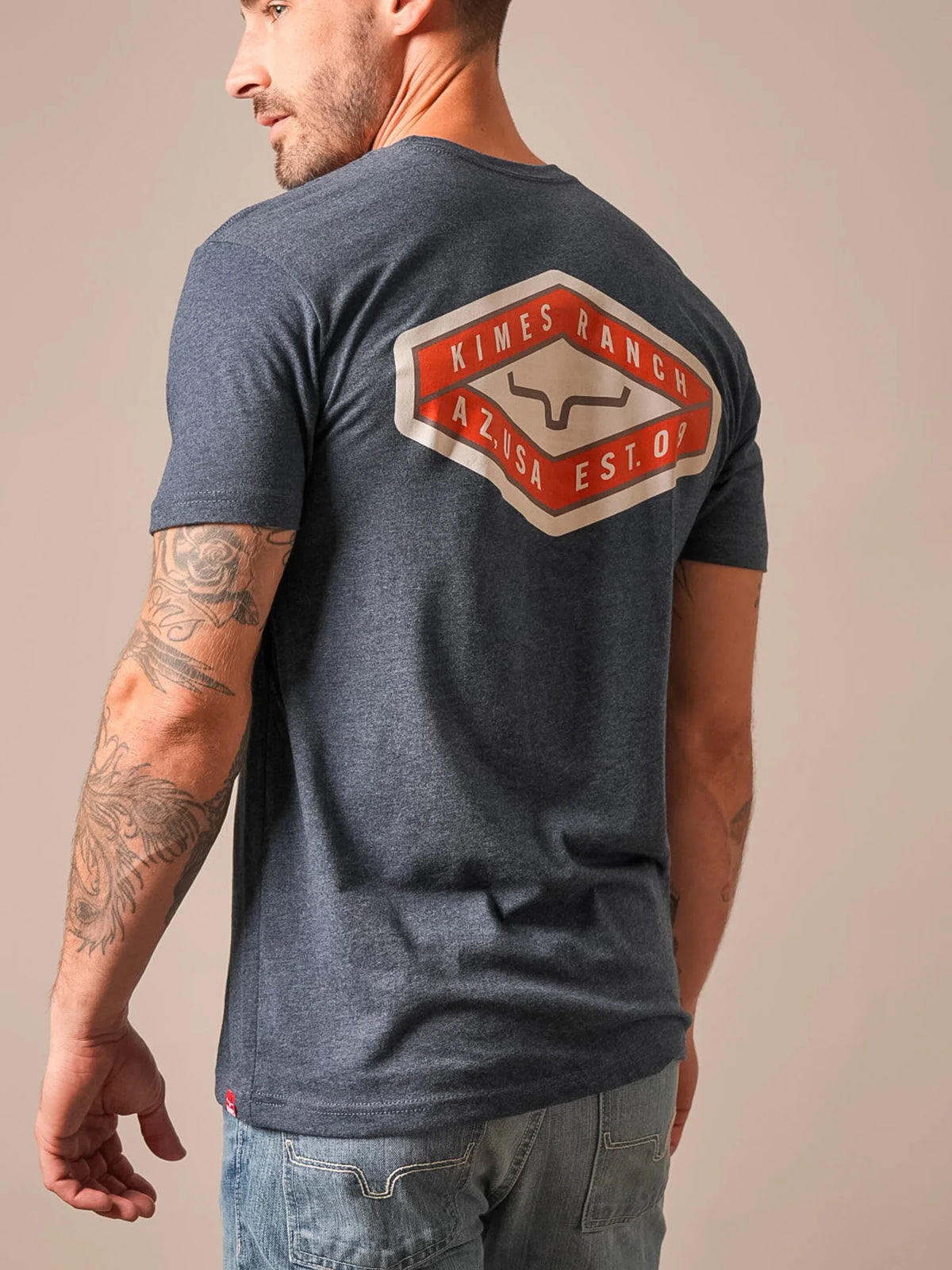 Kimes Ranch Boxer shirt in Midnight Navy, back view, with a large back graphic featuring the Kimes Ranch logo and text