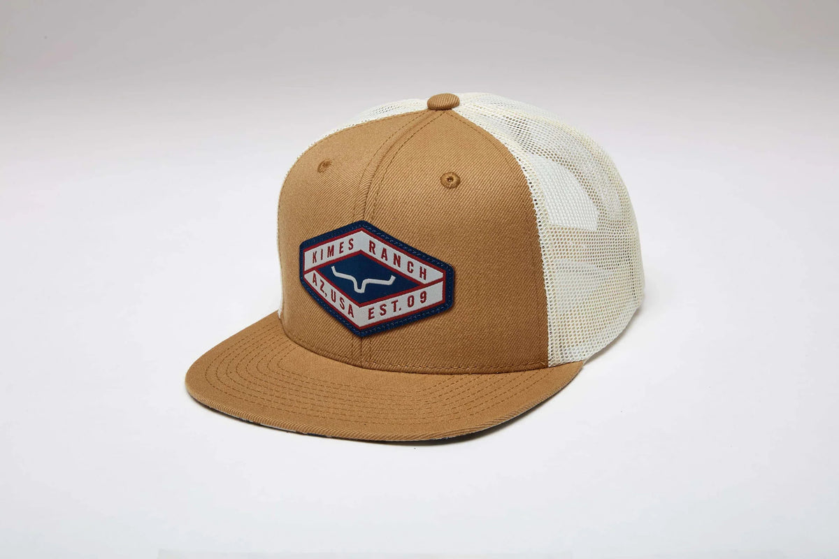 Kimes Ranch Boxer Trucker hat in Work Wear Brown, side view, with a white mesh back and embroidered logo patch