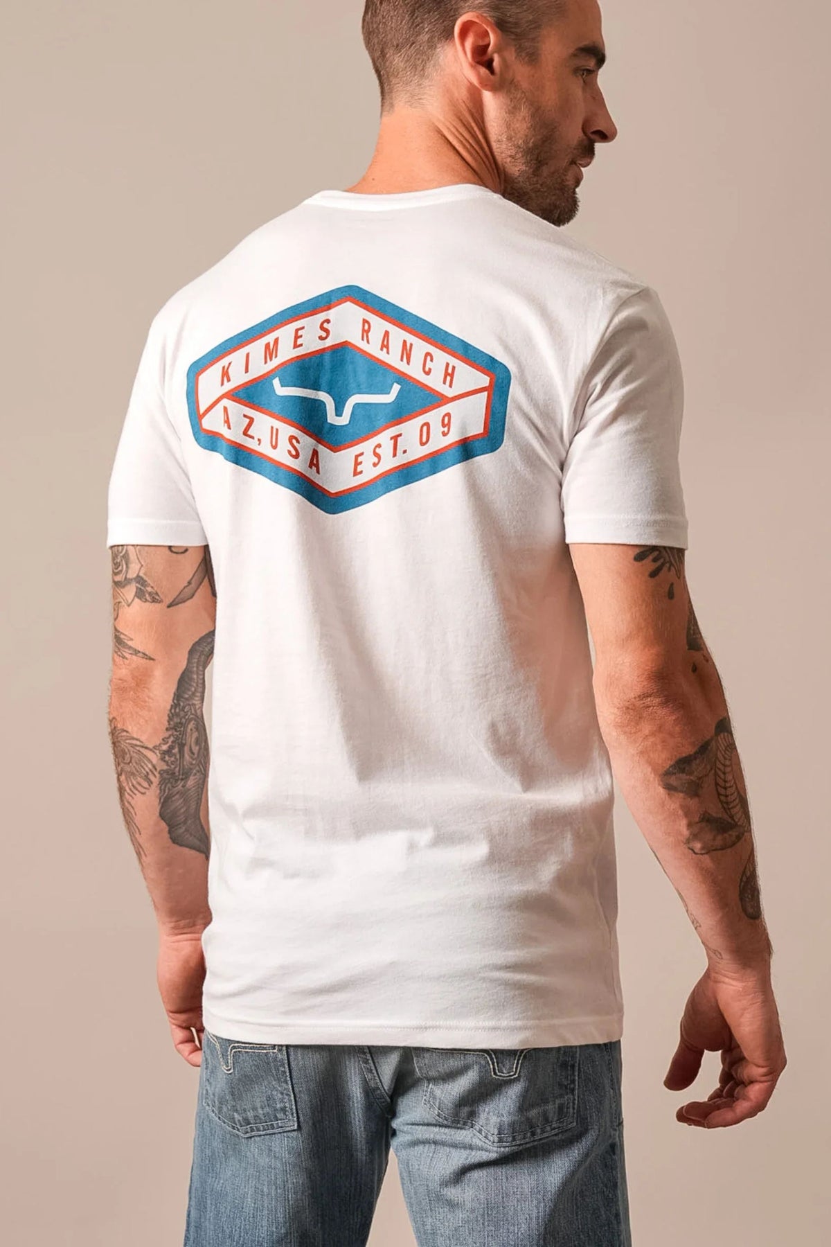 Kimes Ranch Boxer shirt in White, back view, with a back graphic featuring the Kimes Ranch logo and text AZ USA EST 09