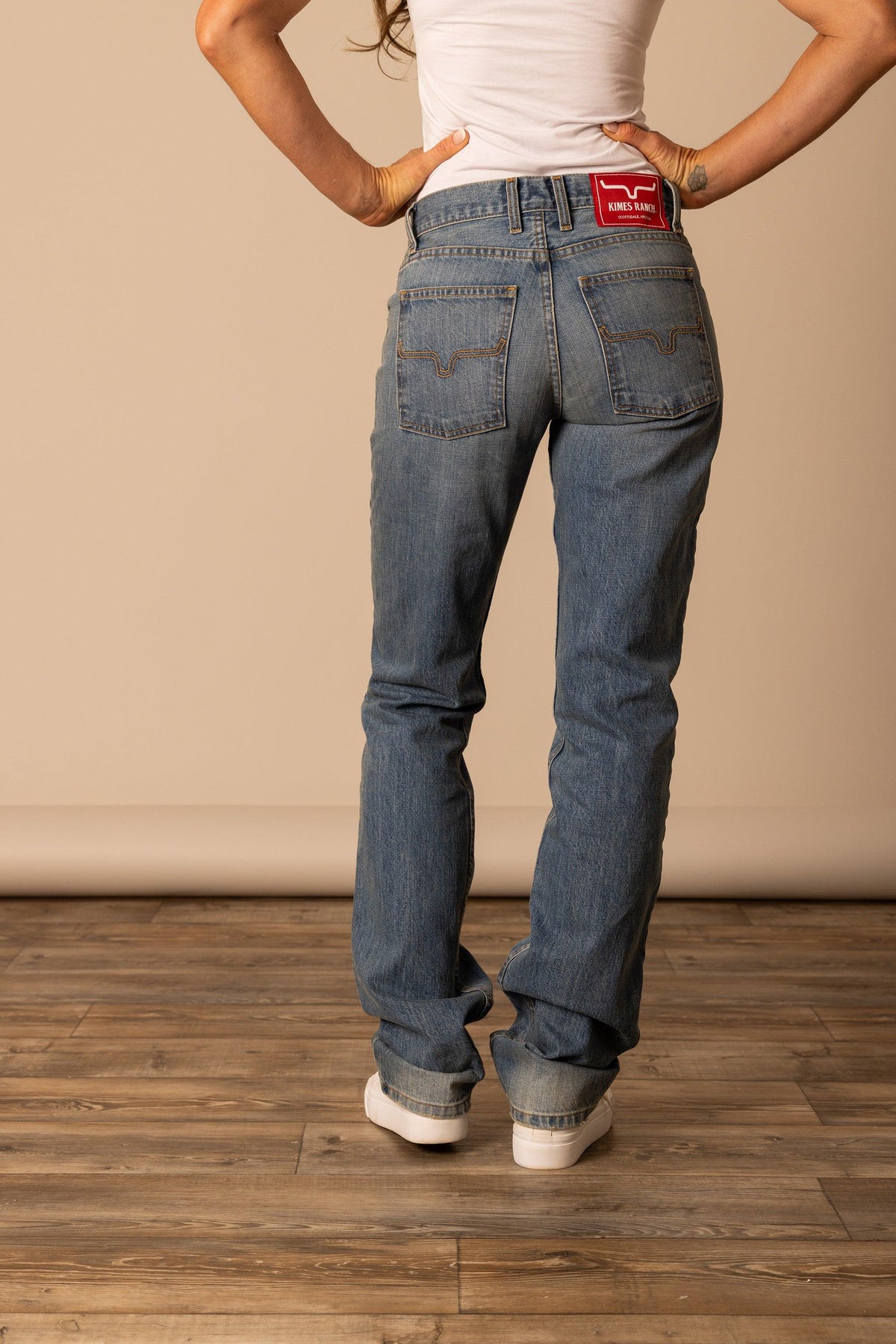 Kimes Ranch Brooks jeans in Mid Wash, back view, with back pockets and red logo patch