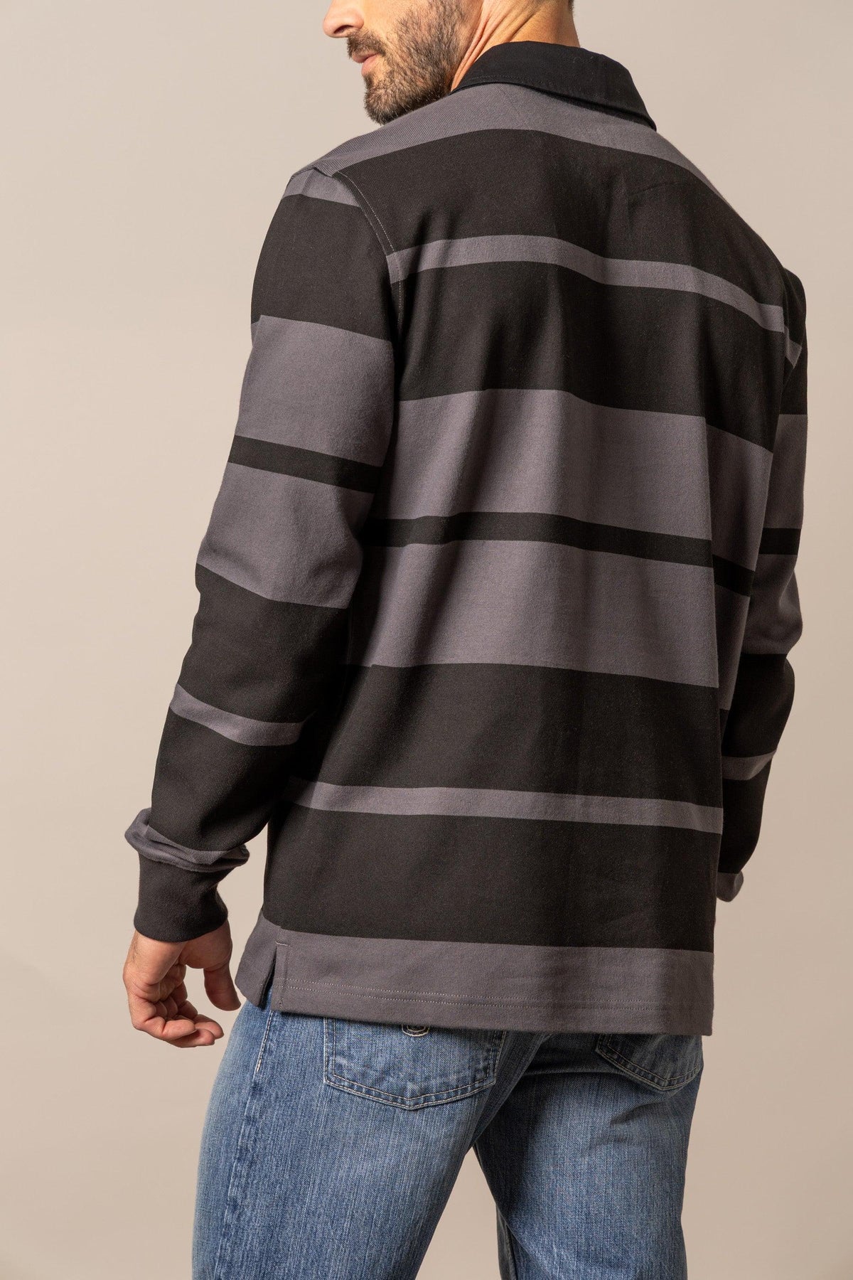 Kimes Ranch Bulldog Rugby polo in Black, back view, with wide grey horizontal stripes and a solid collar