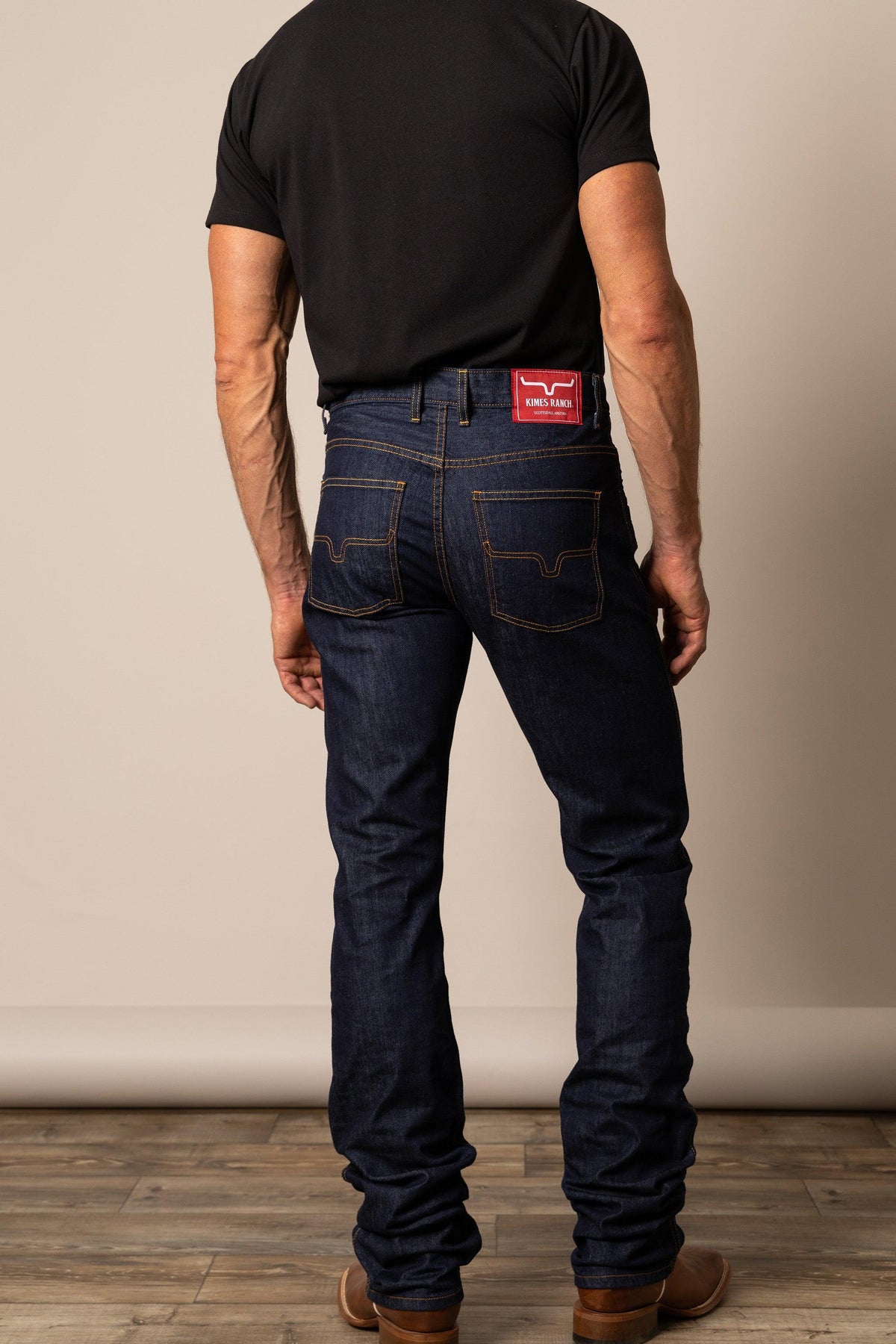 Kimes Ranch Cal Straight Fit Bootcut jeans in Dark Wash, back view, with back yoke and red logo patch