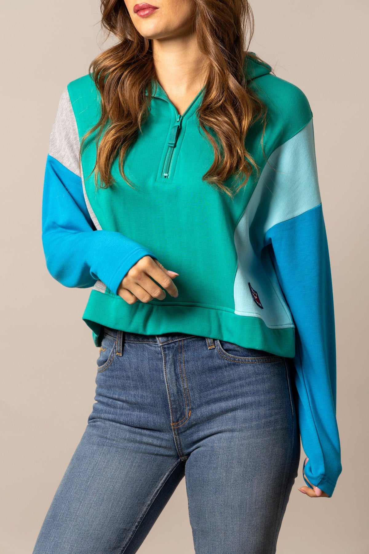 Kimes Ranch Cami Sweater in Green with colorblocked blue and grey sleeves and a half-zip front with a Kimes Ranch logo