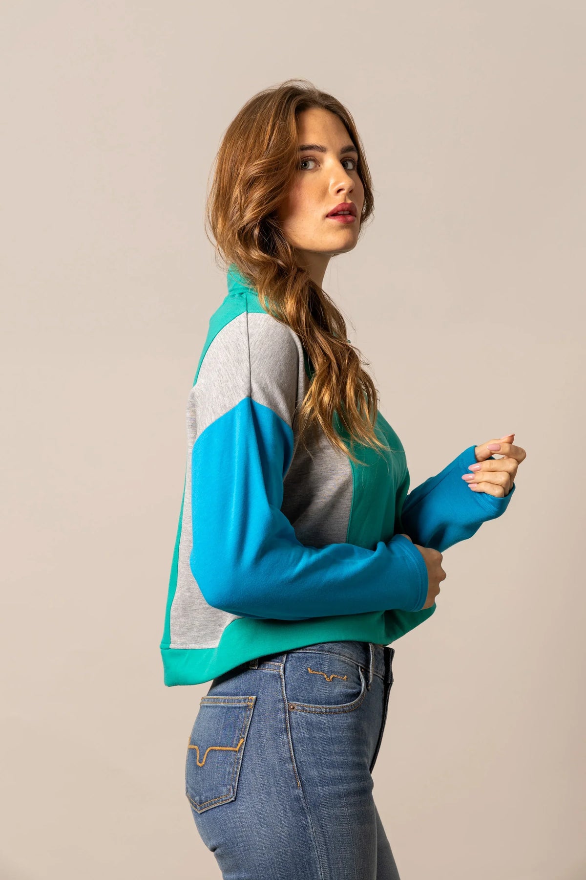 Kimes Ranch Cami Sweater in Green, side view, with grey and blue colorblock sleeves and a crewneck