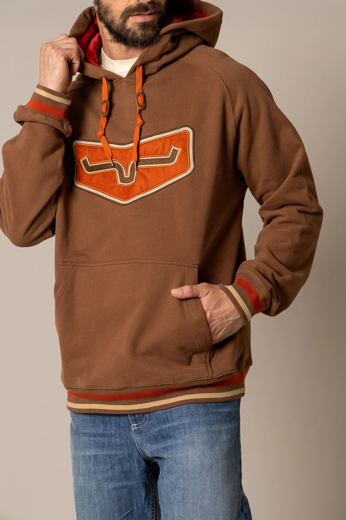 Kimes Ranch Cannons Hoodie in Brown with a large orange and Brown logo on the chest and striped cuffs
