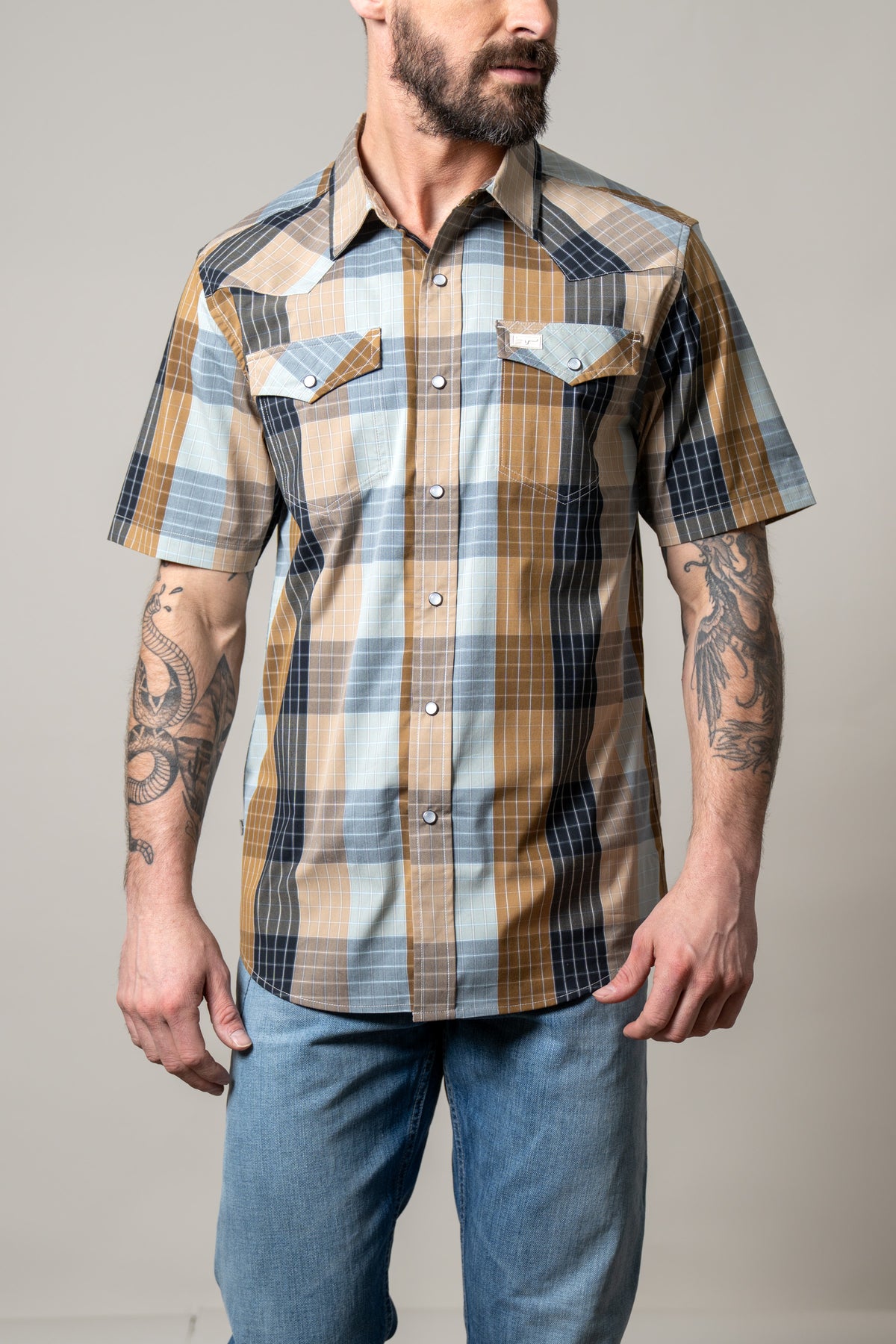 Kimes Ranch Chico short sleeve western shirt in Brown with multi-color plaid and two button flap pockets