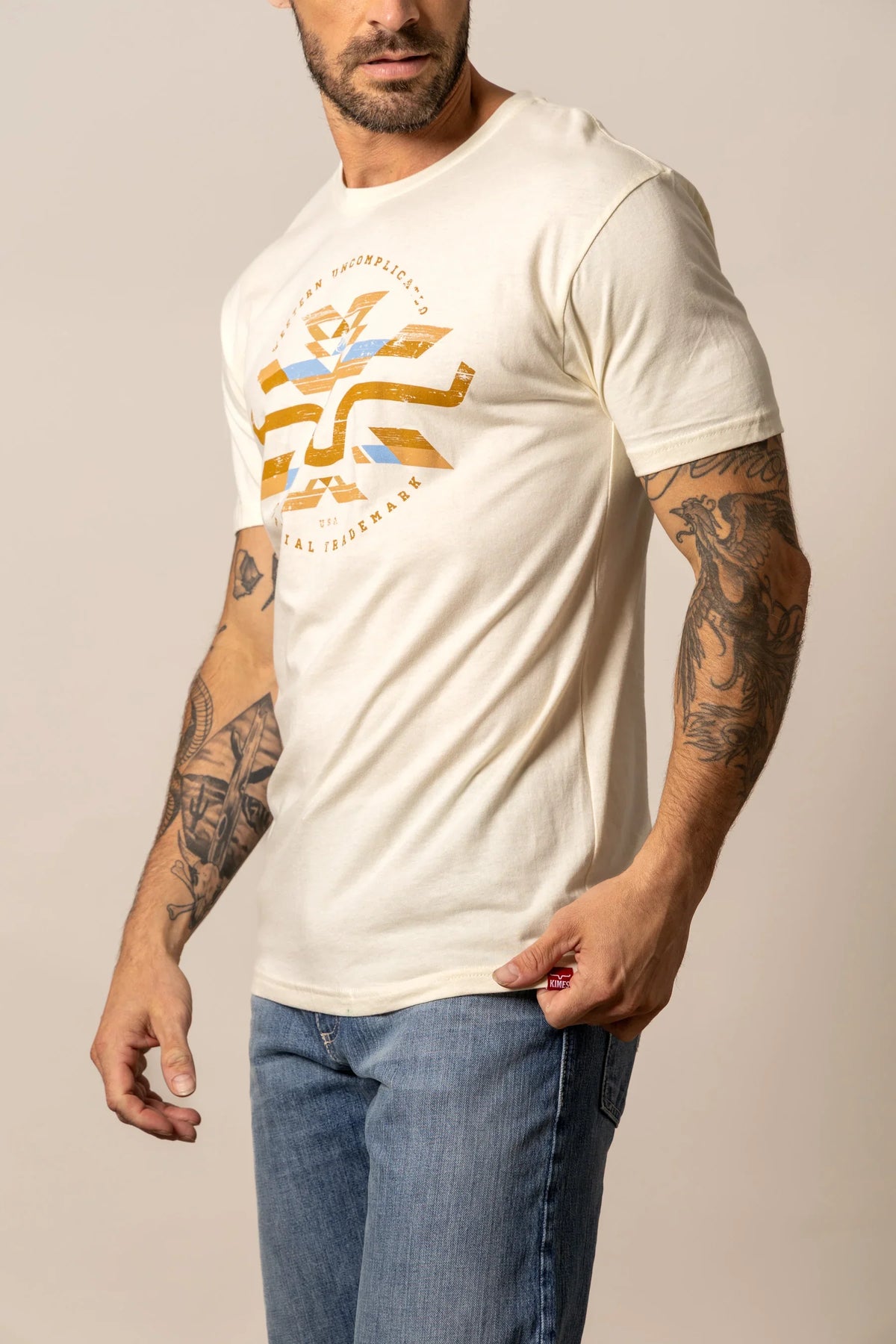 Kimes Ranch Circular Serape shirt in Natural, side view, with a front graphic print and short sleeves