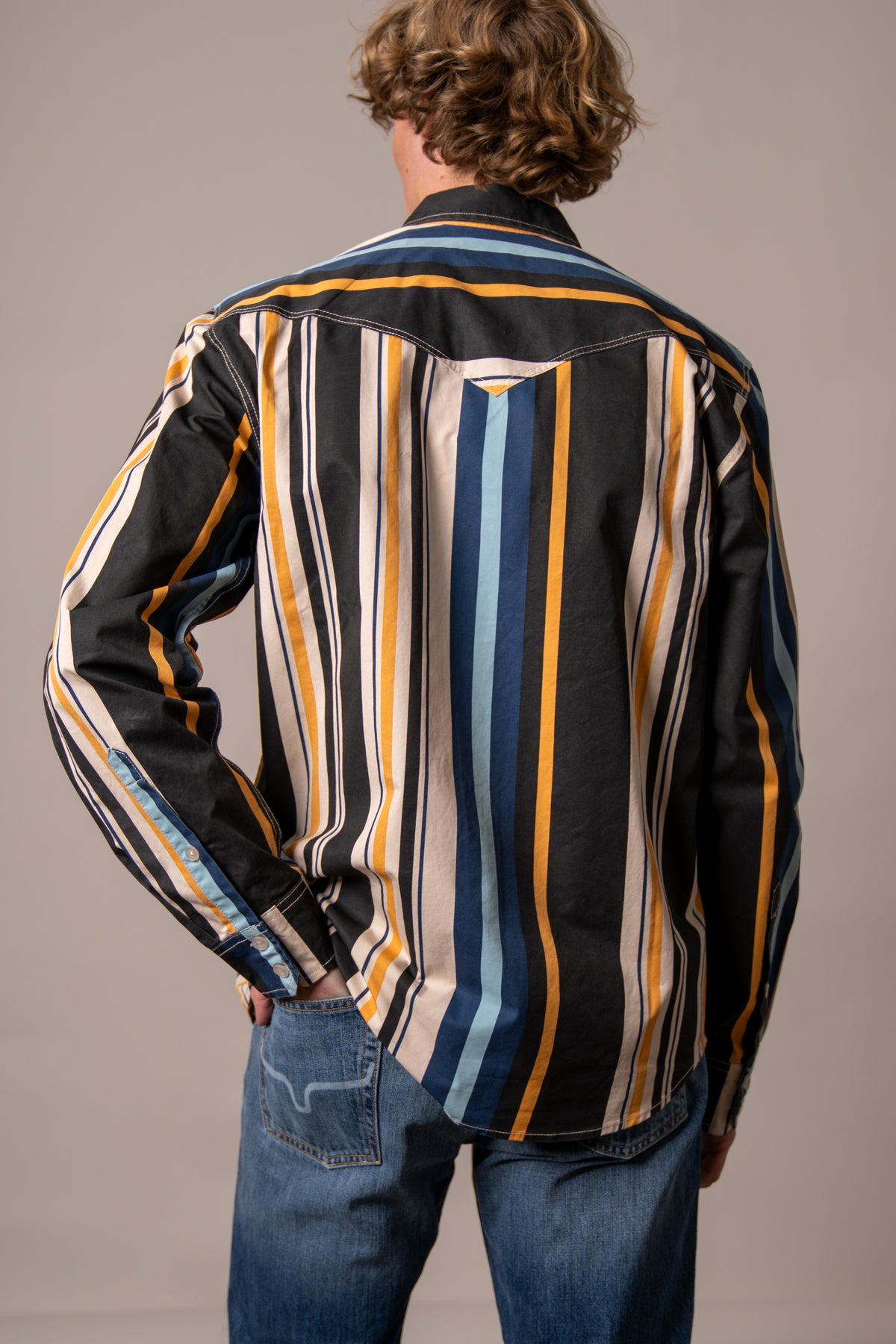 Kimes Ranch Clancy dress shirt in Black, back view, with vertical stripes in blue, yellow, and white