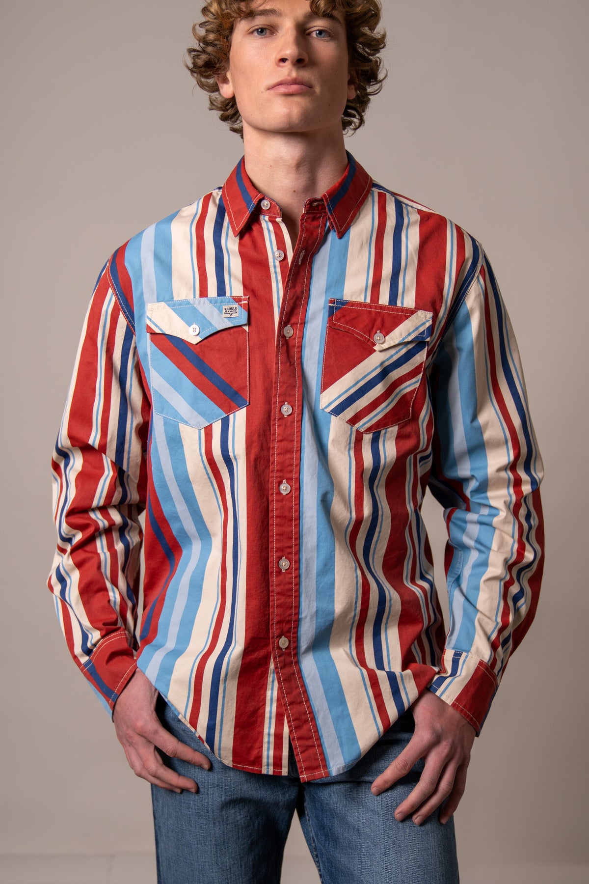 Kimes Ranch Clancy dress shirt in Brick Red with blue and white vertical stripes and two chest pockets