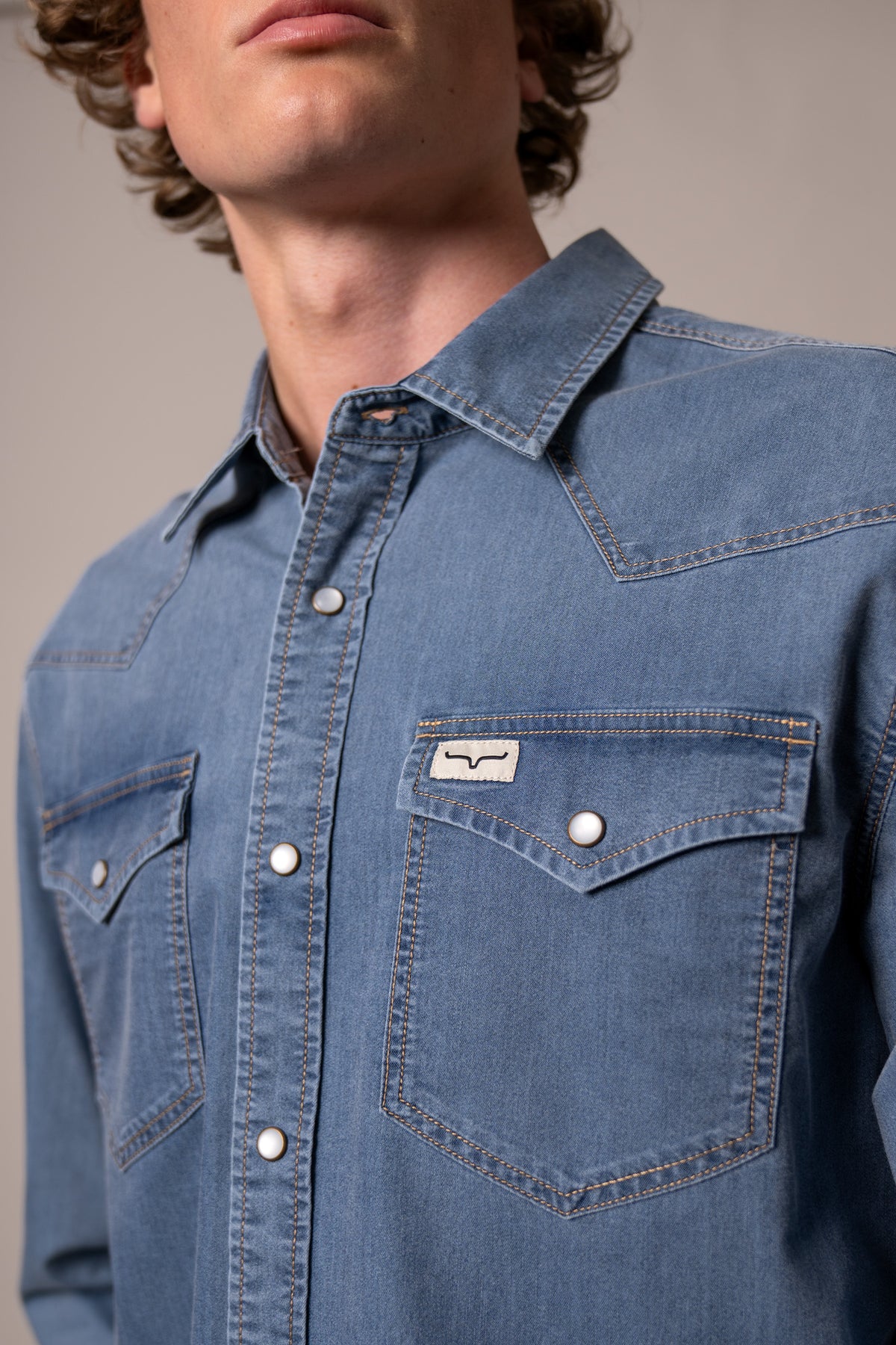 Kimes Ranch Cleavon Blue dress shirt with a close-up of the collar and chest pockets with the Kimes Ranch logo