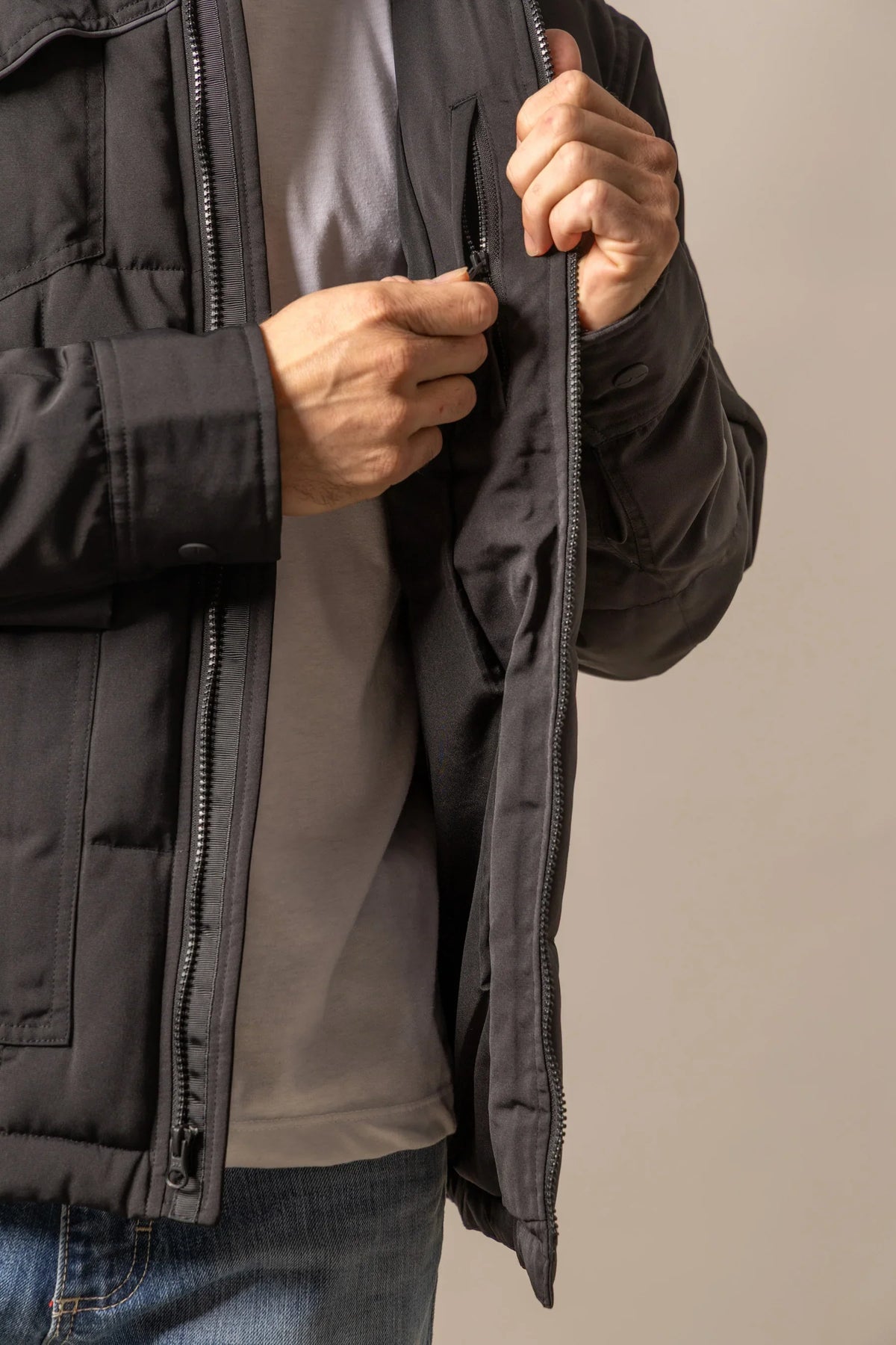 Kimes Ranch Colt Jacket in Black with a close-up of the front zipper and interior lining