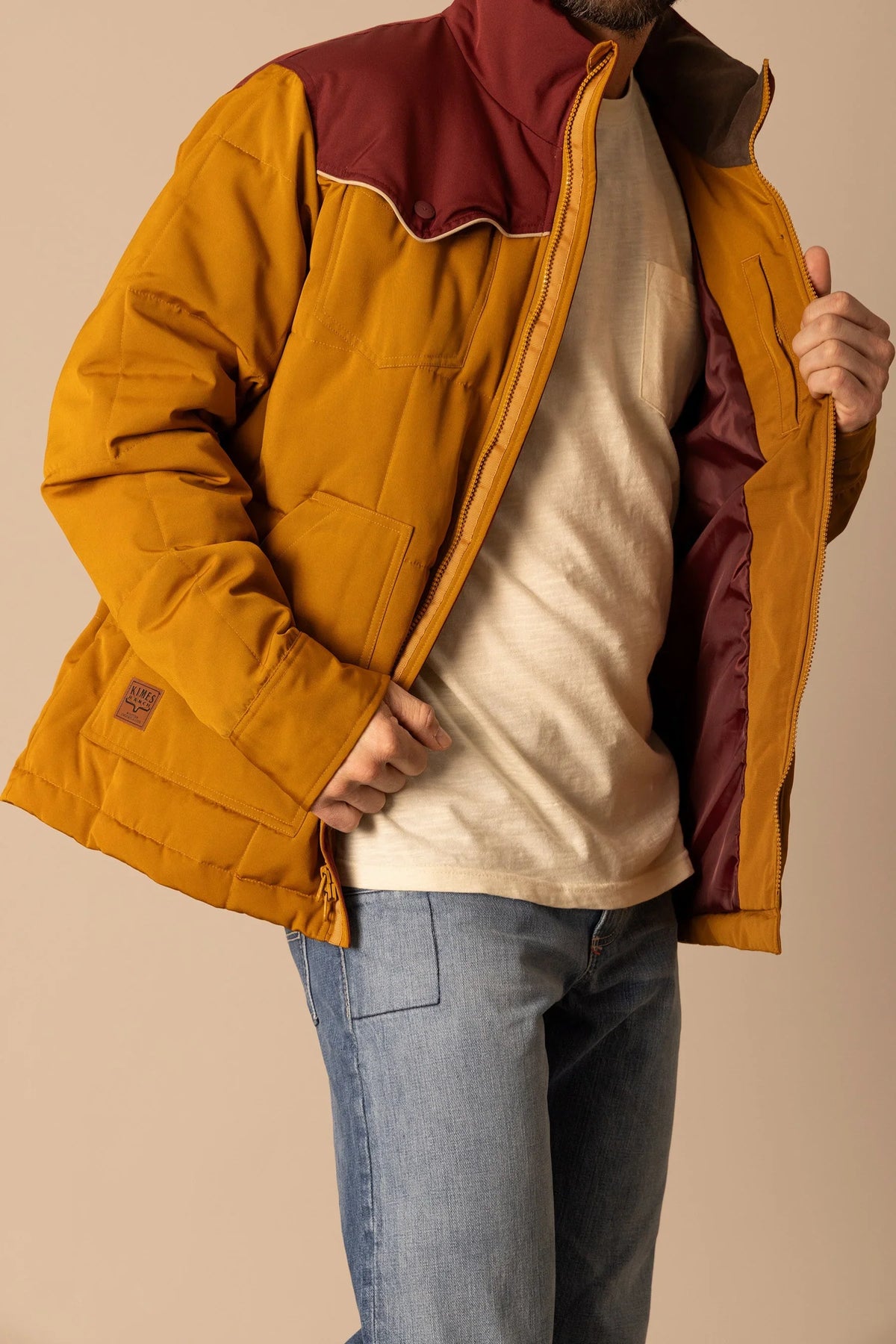 Kimes Ranch Colt Jacket in Work Wear Brown, side view, with maroon yoke and front pockets